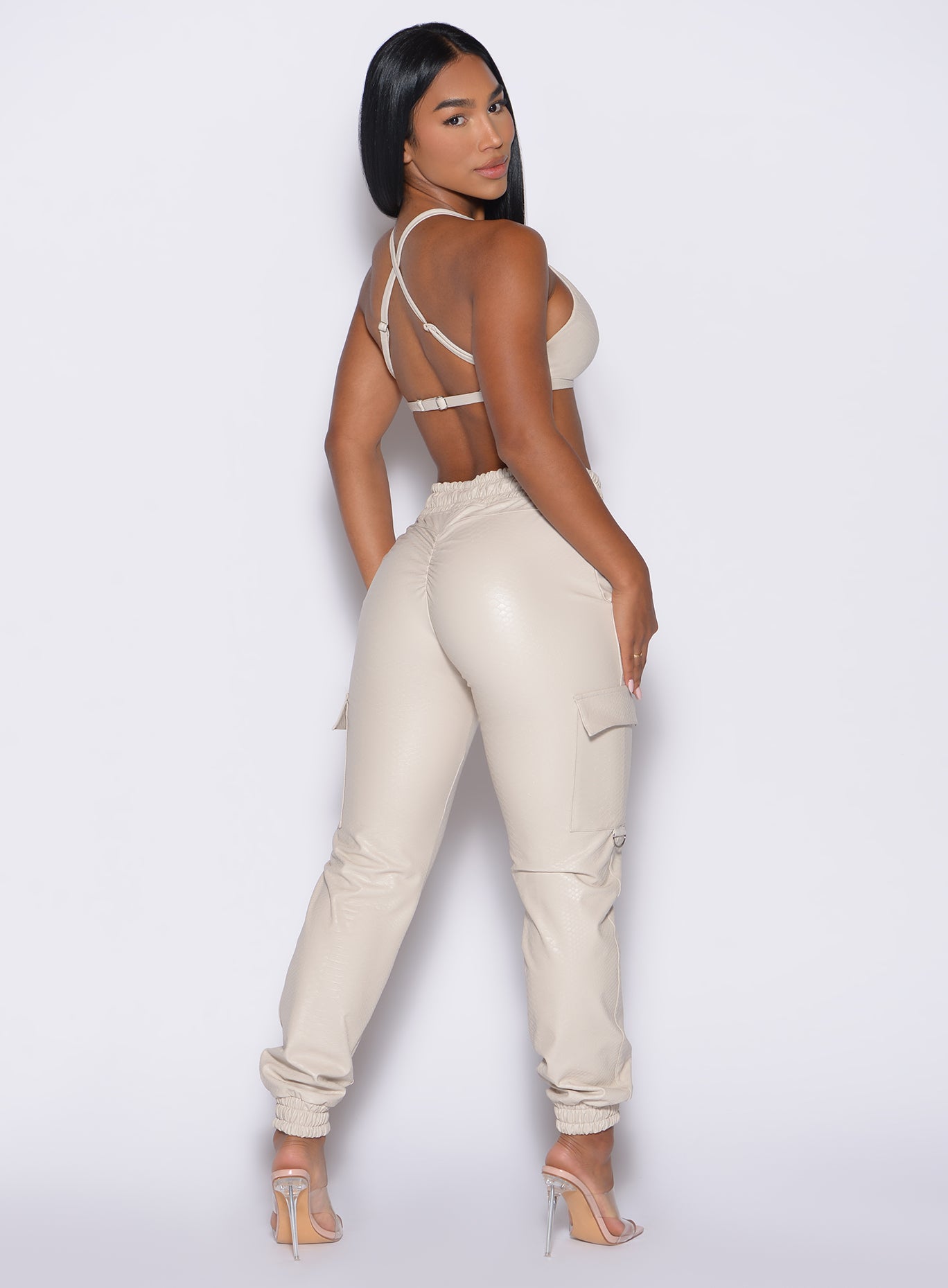 High-waisted champagne Liquid Cargos in sleek PU leather with a contouring scrunch-back fit.