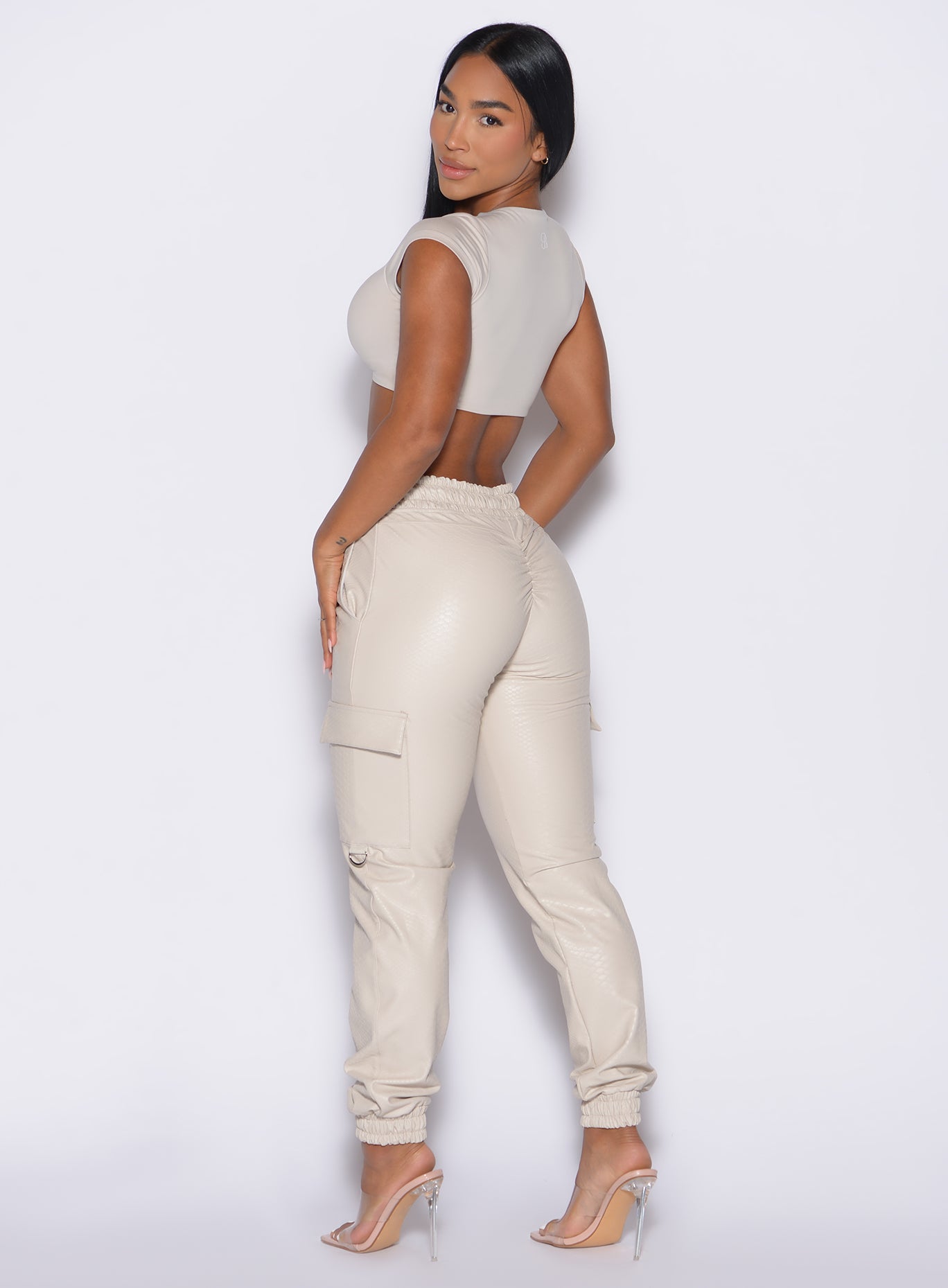 Champagne Liquid Cargos in sleek PU leather with a high-waisted, sculpting scrunch-back fit.
