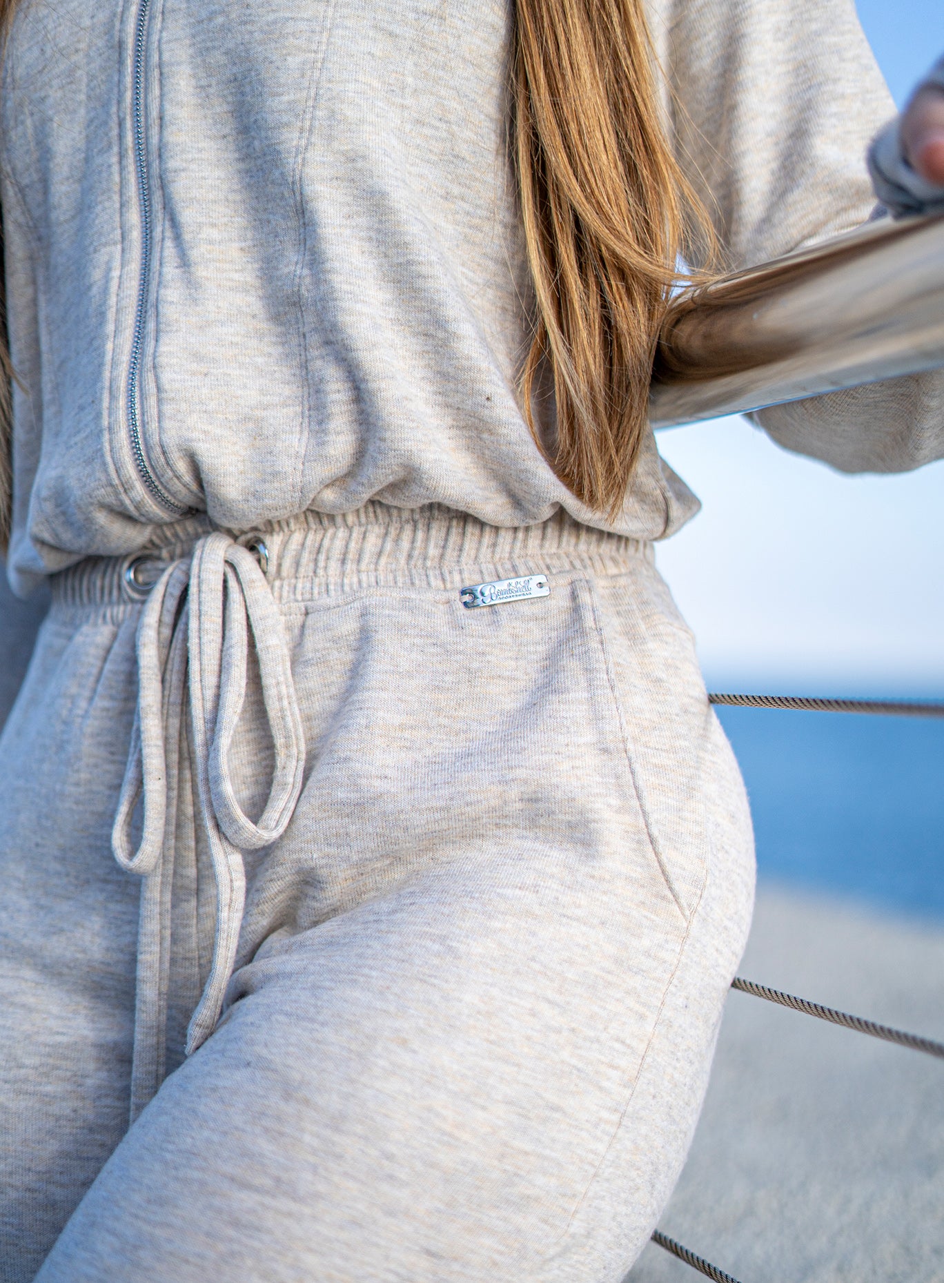 Cozy Oat Flirty Jumpsuit featuring a soft, body-sculpting fit for premium, stylish lounging.
