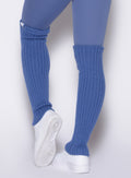 back profile view of a model wearing the Luxe Leg Warmers in blue chill color