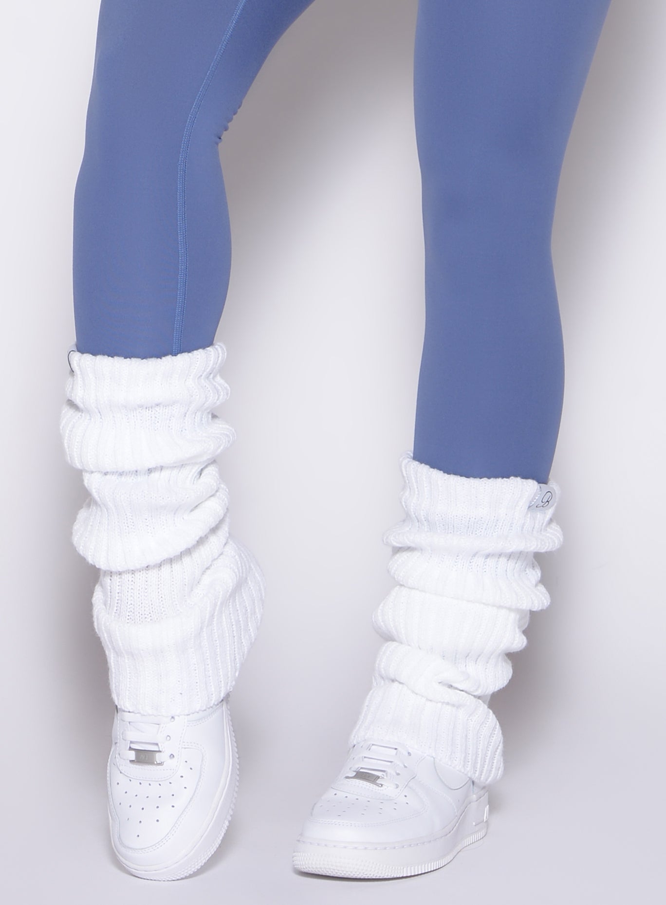 White Luxe Leg Warmers in plush ribbed knit with stay-put elastic for an elevated gym look.