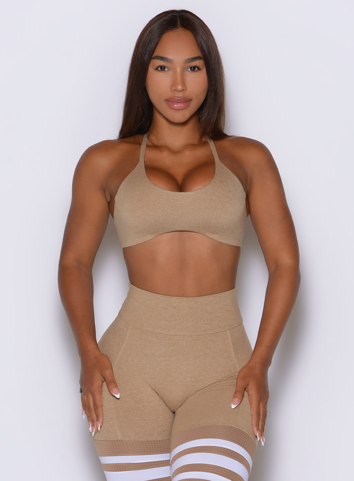 Subtle and streamlined, the Sandstone ME Sports Bra shapes the figure with a curved underbust