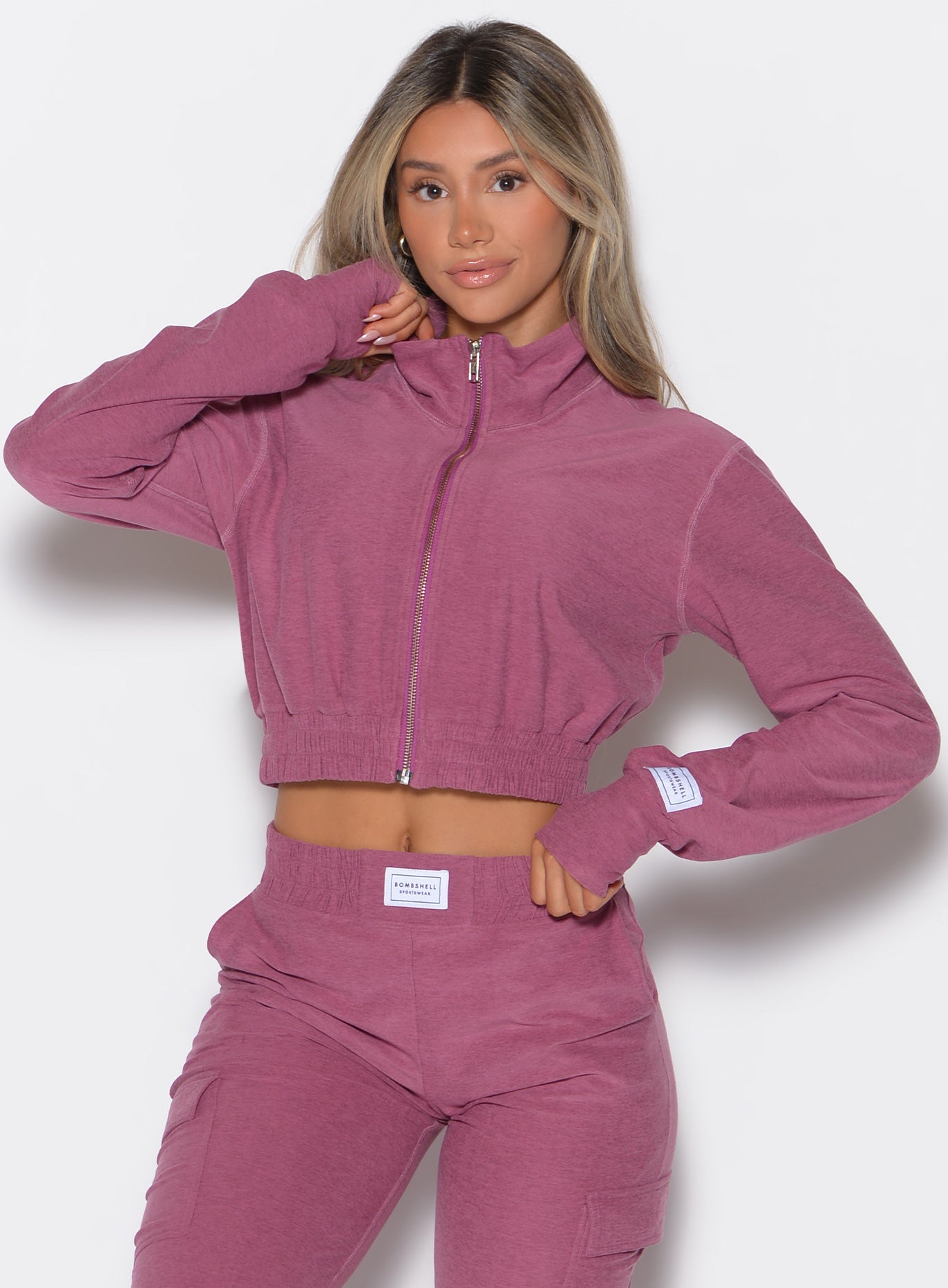 Purple Rose Cloud Crop Jacket featuring a high mock neck and thumbholes for stylish gym lounging.