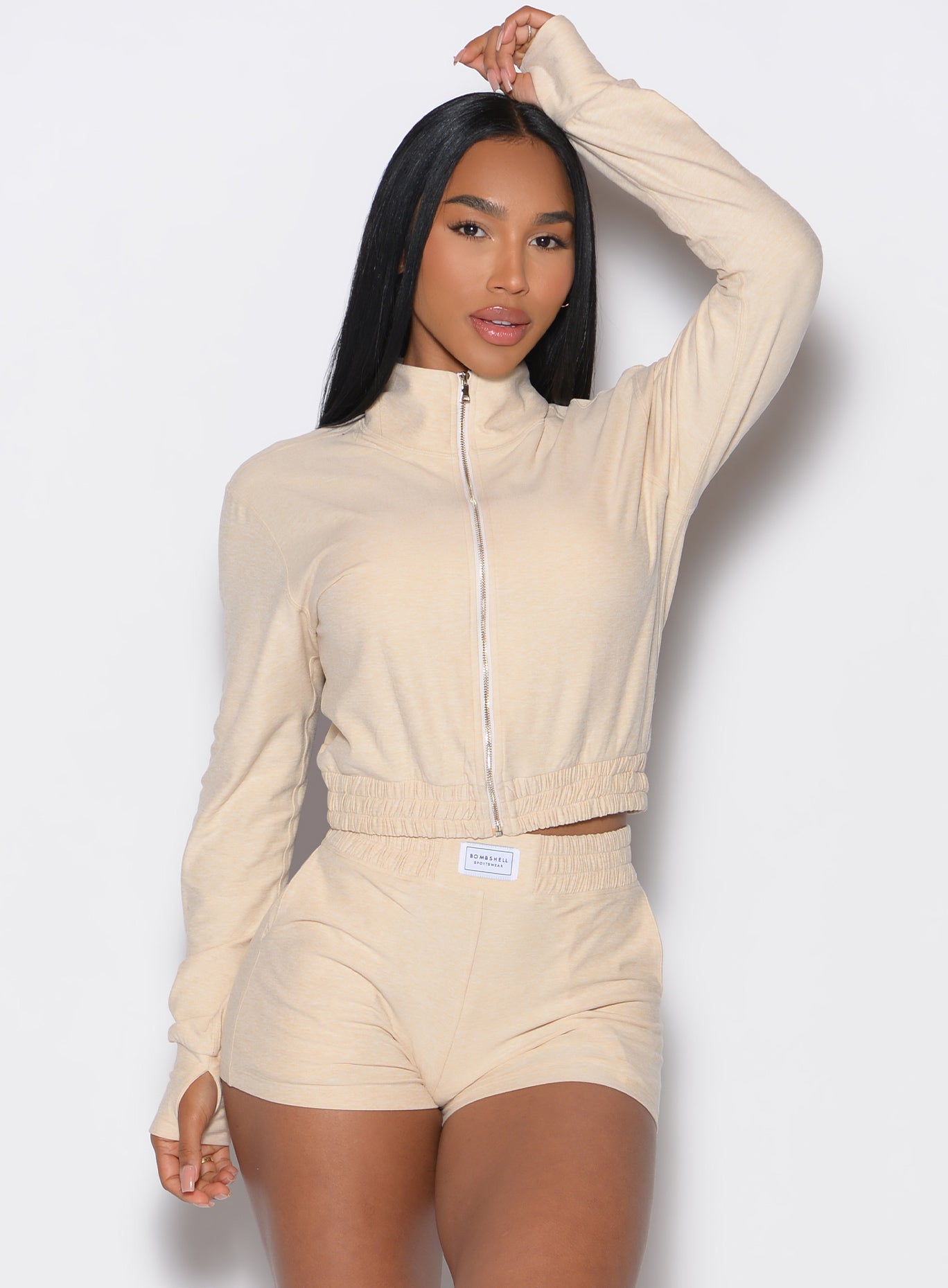 Vanilla Cloud Full Length Jacket with mock neck and full zip, designed for a sculpted gym profile.