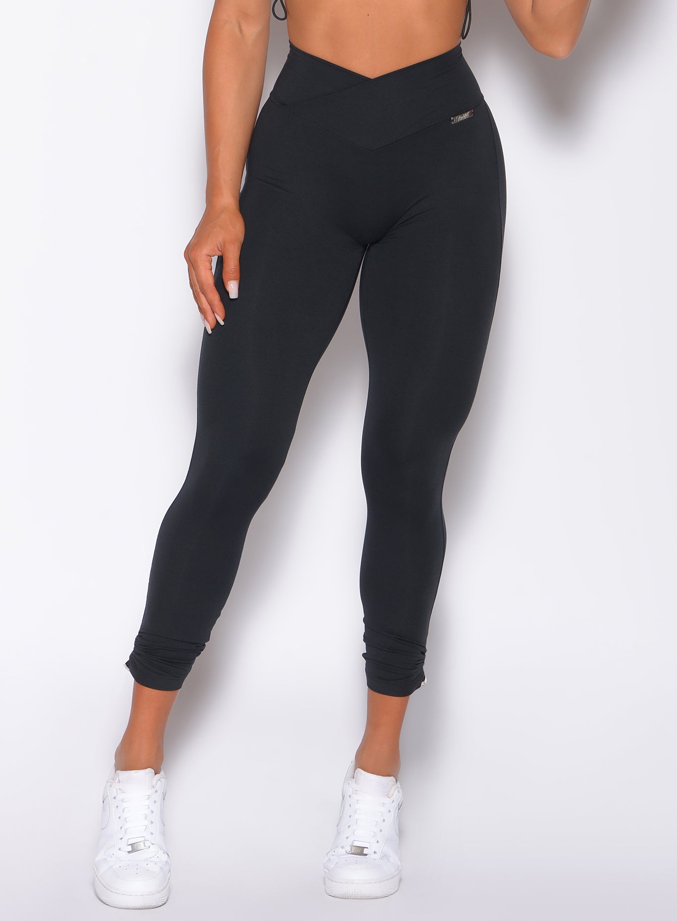 Black Contour Toggle Leggings featuring an adjustable V-waist for a sculpted gym look.