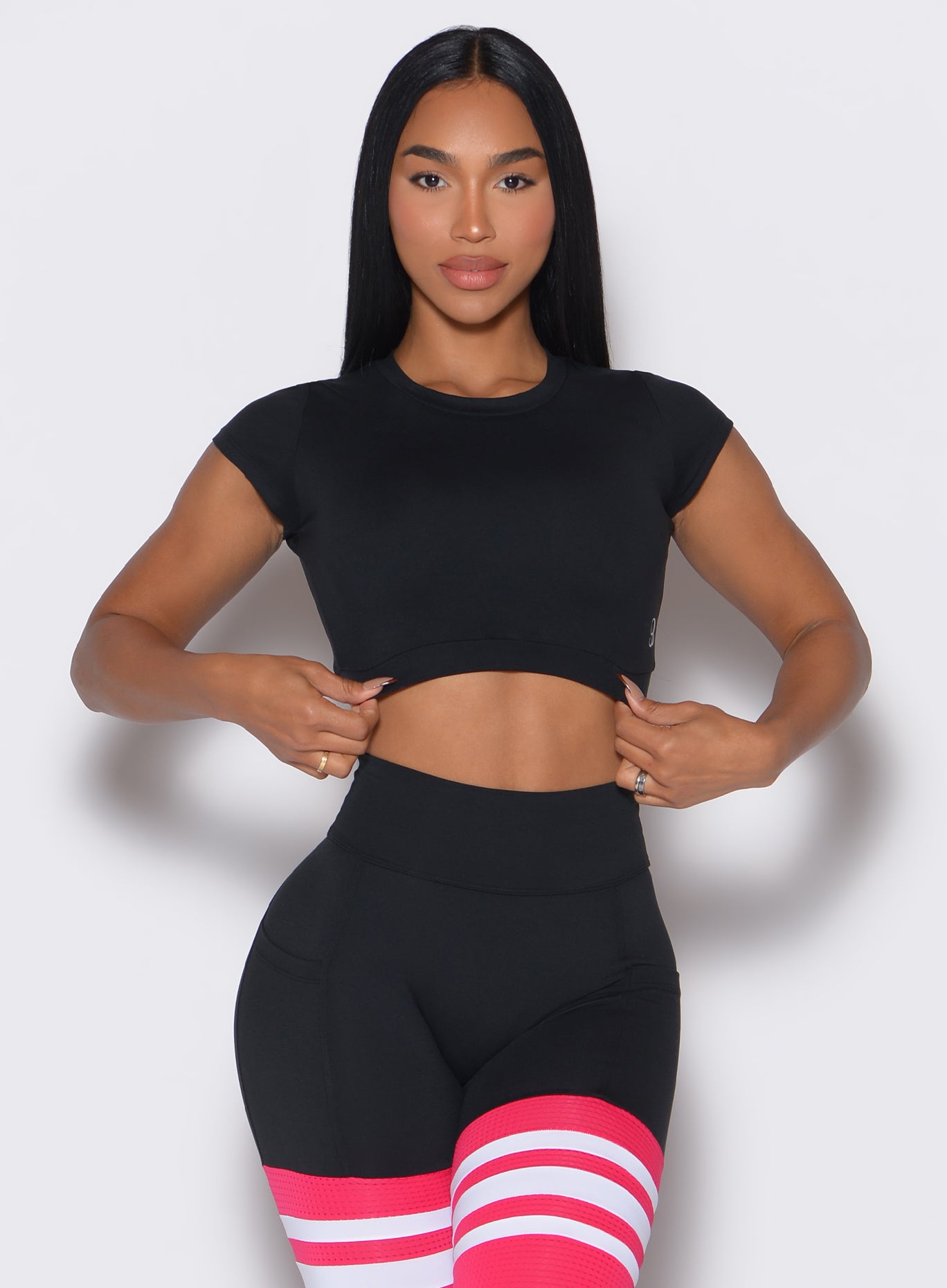 Black Open Back Tee with a double-layered front and cap sleeves for breathable gym style.