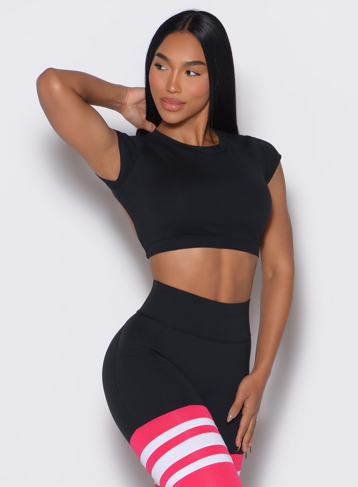 Black Open Back Tee with breathable cropped fit, perfect for layering during intense gym sessions.
