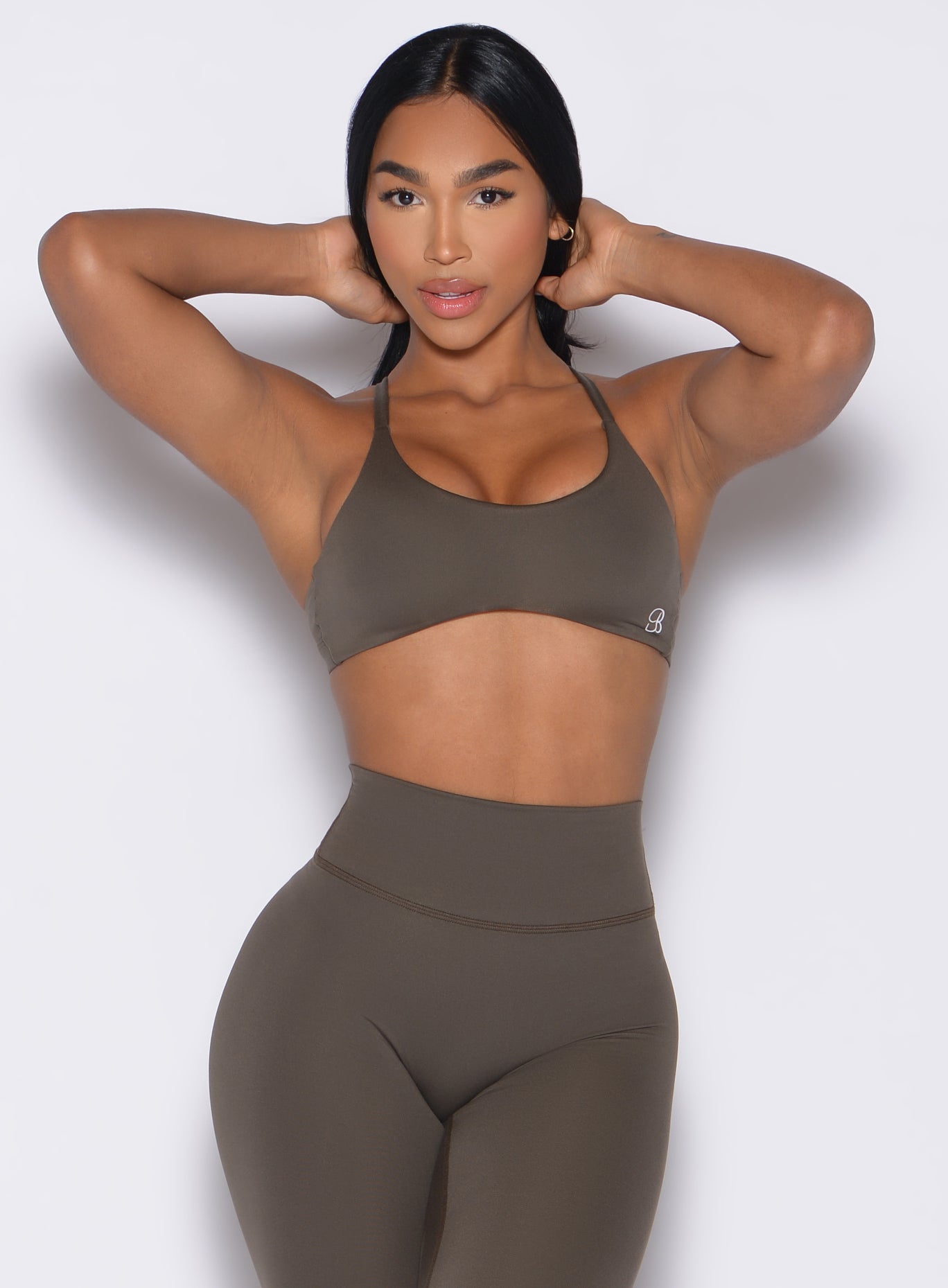 Sculpting Winter Oak Passion Sports Bra with a curved underbust and strappy back for intense gym days.