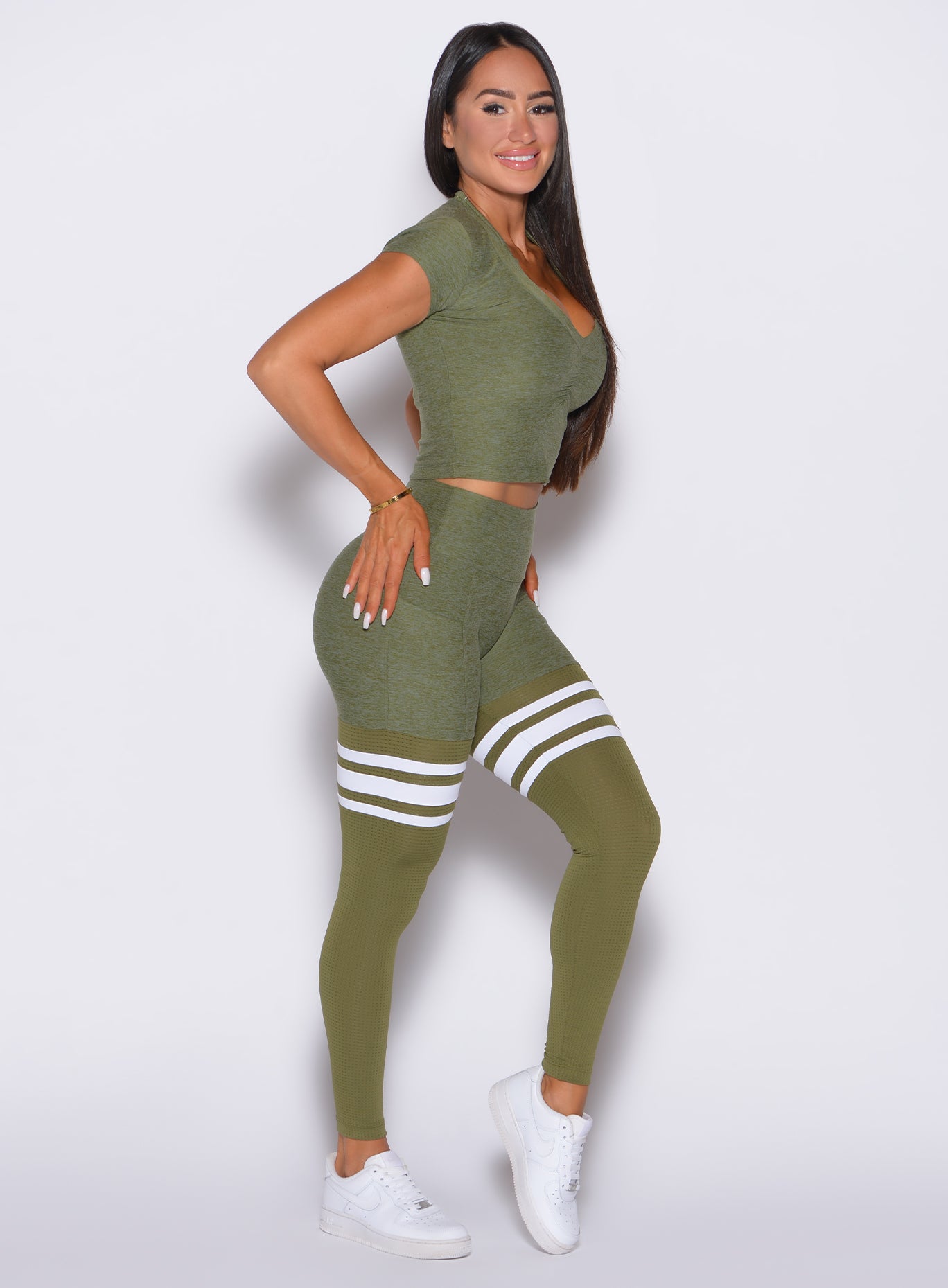 Lily Pad Perform Thigh-Highs with breathable mesh and side pockets for a sculpted gym look.