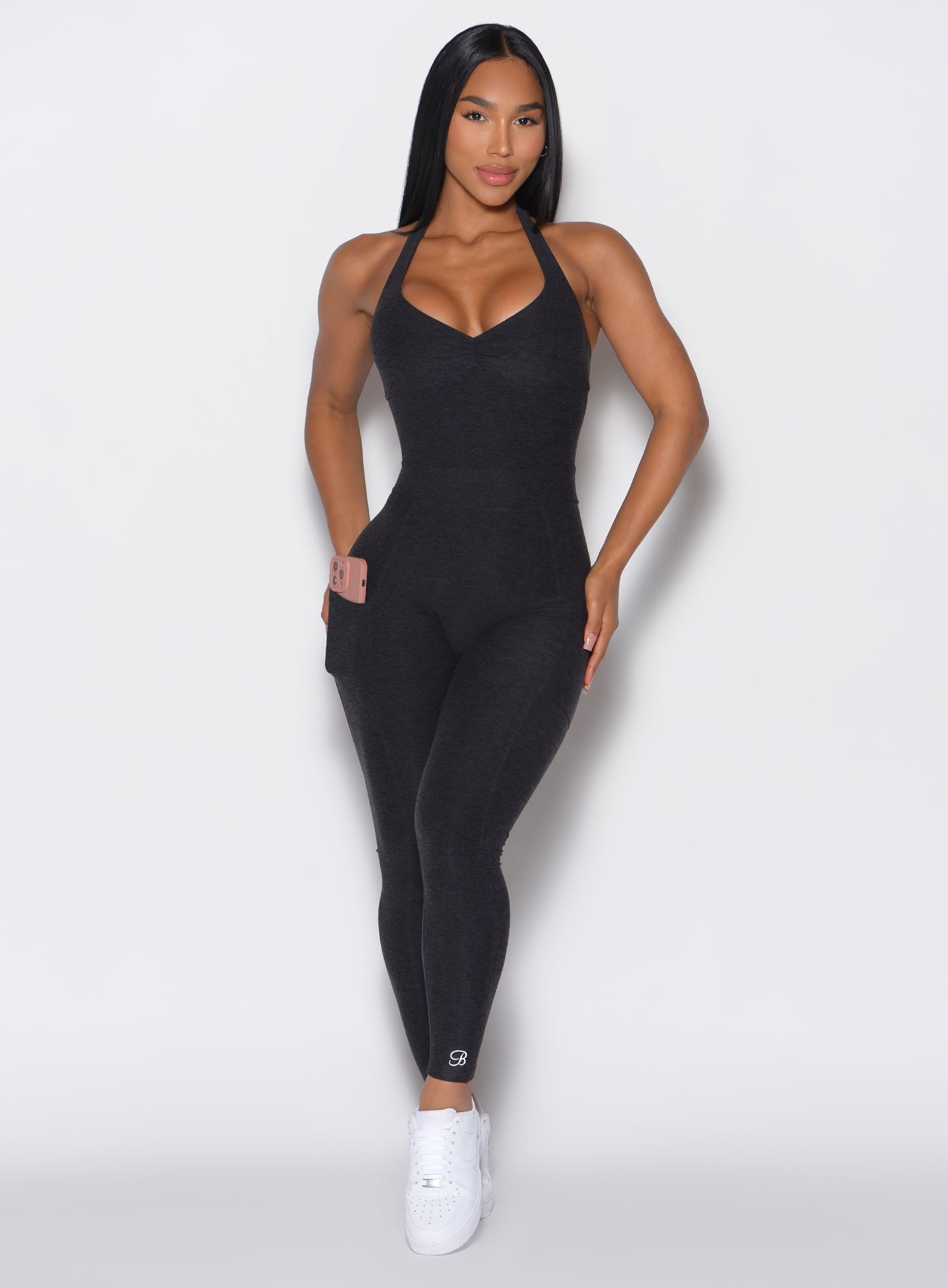 Sculpting Onyx Backless Pocket Bodysuit with a halter neck and side pockets for gym gains.