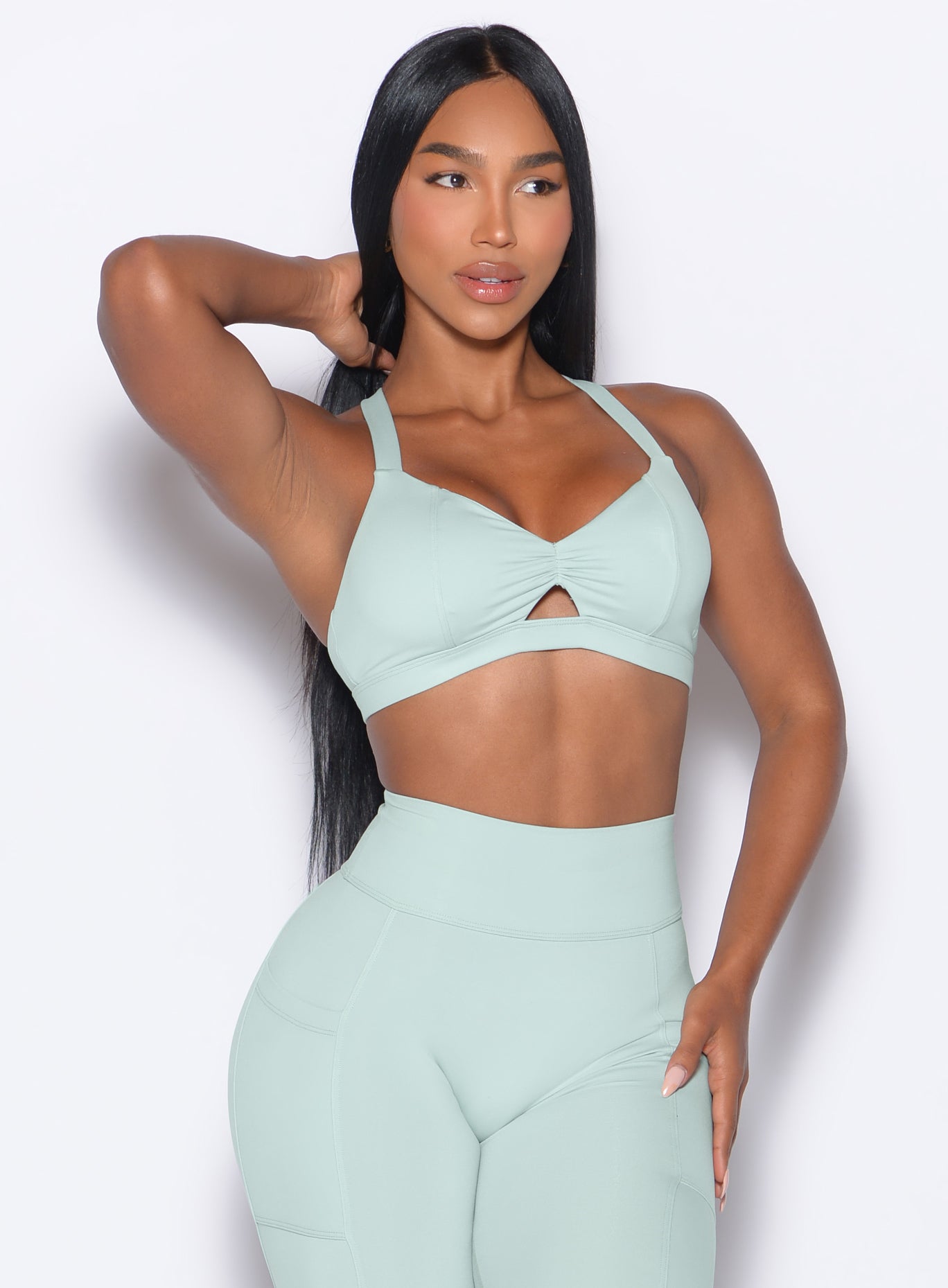 Mist Sweetheart Sports Bra with a front keyhole and sculpting scrunched center for gym performance.