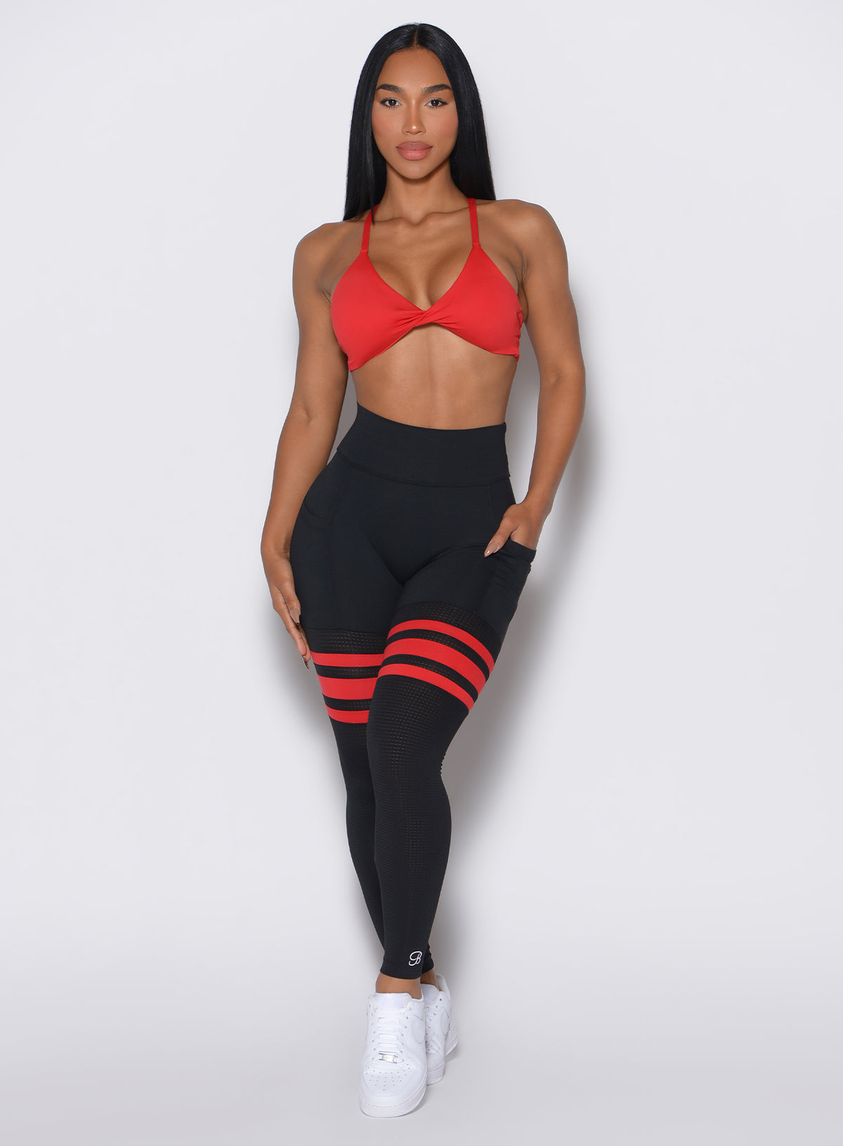 Black Fire Scrunch Thigh-Highs with mesh panels and side pockets for a sculpted gym look.