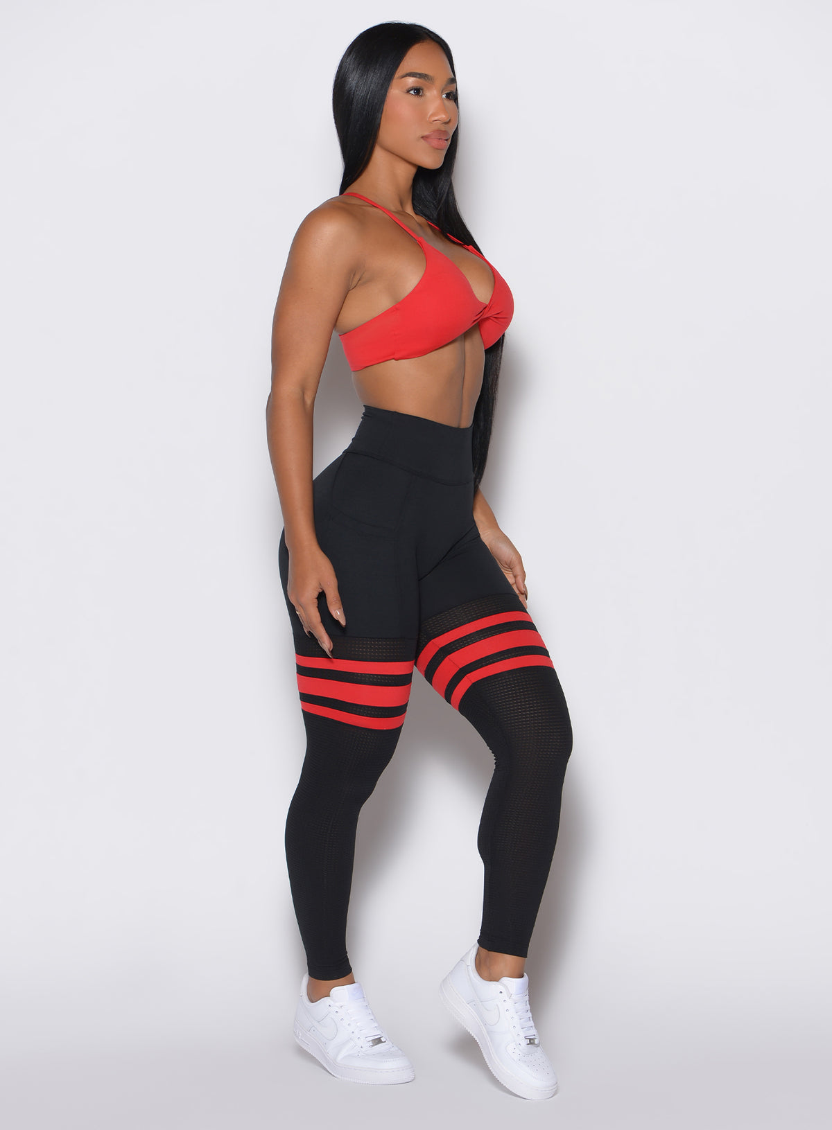 Black Fire Scrunch Thigh-Highs with breathable mesh and side pockets for a sculpted gym look.