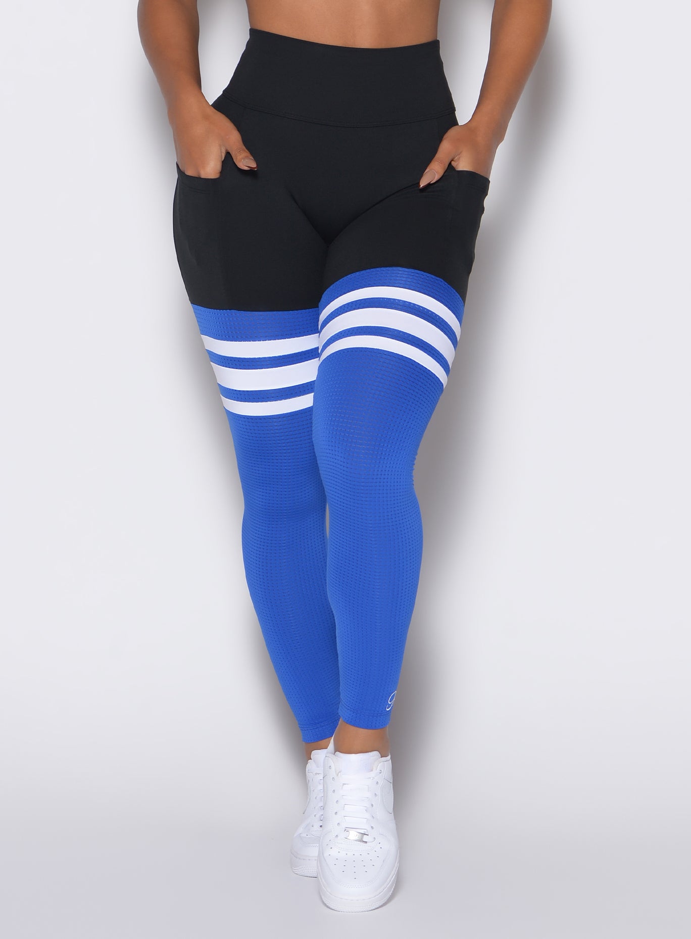 Zoomed in front profile view of a model wearing our Scrunch Thigh Highs in Black Sky color