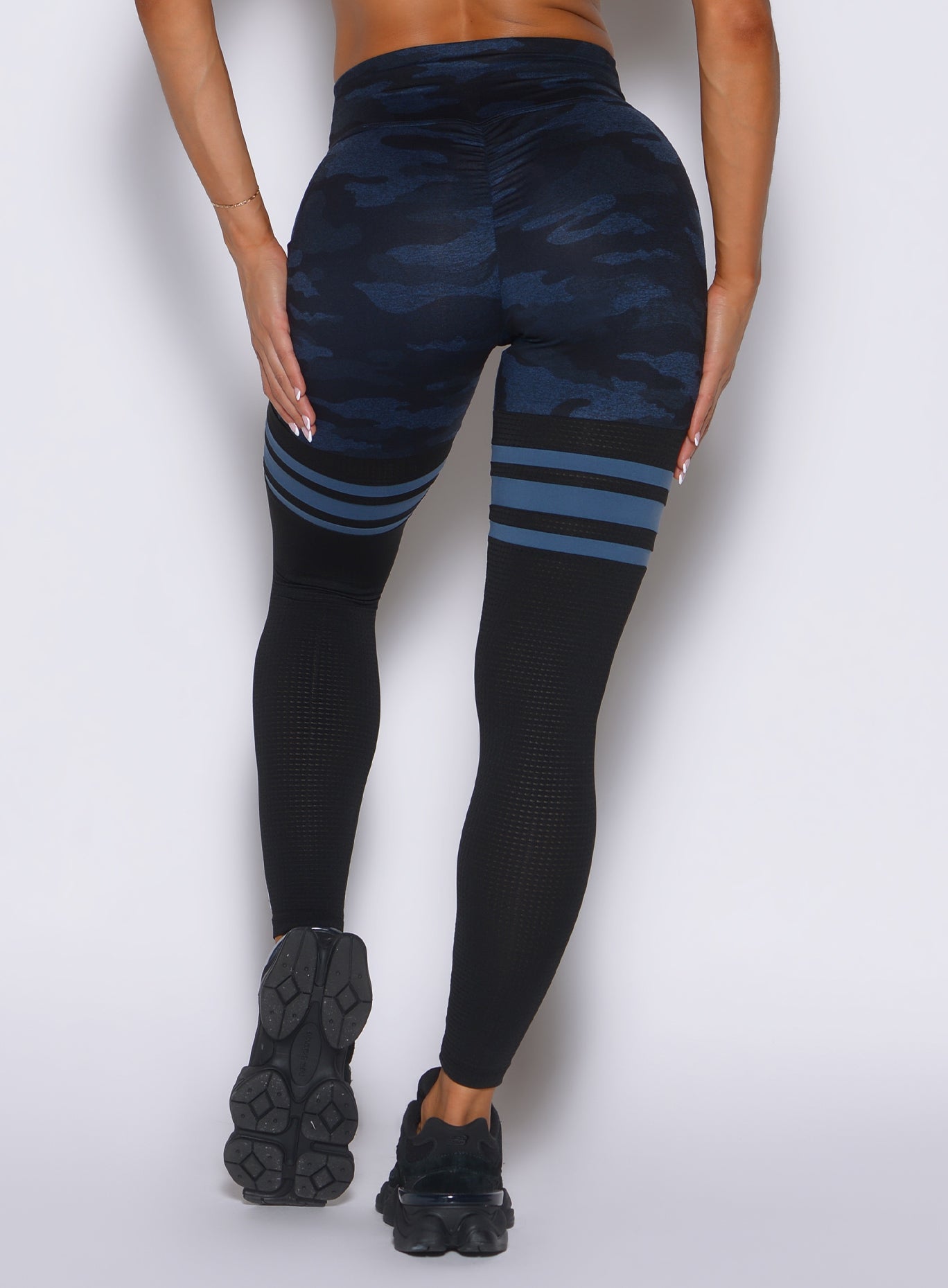 close up back profile view of a model wearing the Scrunch Thigh Highs in Blue/Black camo color