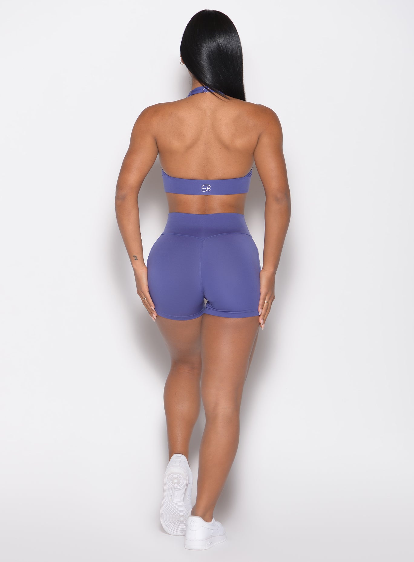 back profile view of a model wearing the Sculpt Knot Shorts in future dusk color