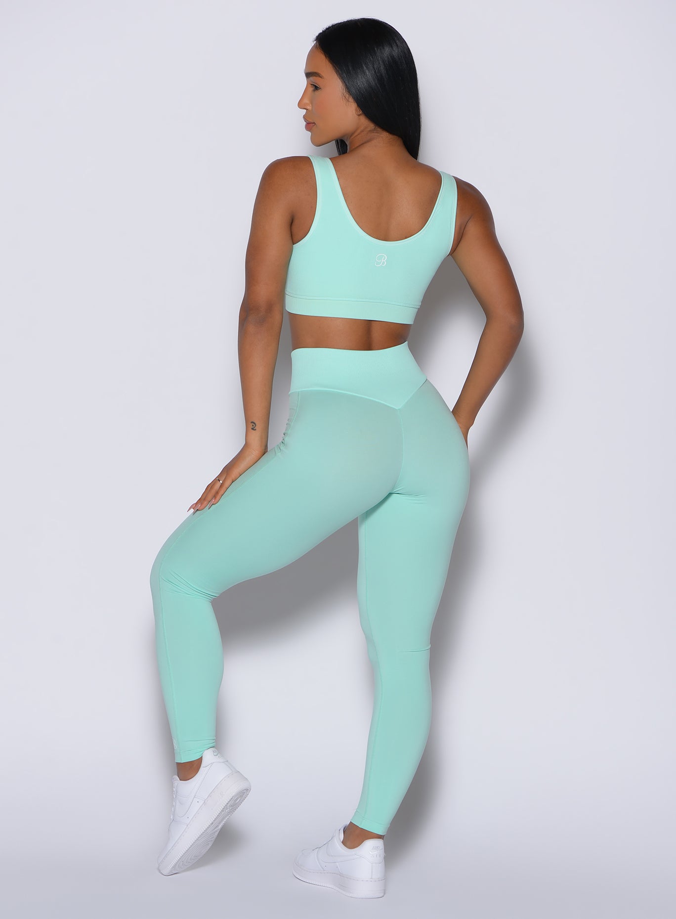 Sculpting Spring Mint Figure Leggings featuring a seamless ribbed waistband for a snatched gym fit.