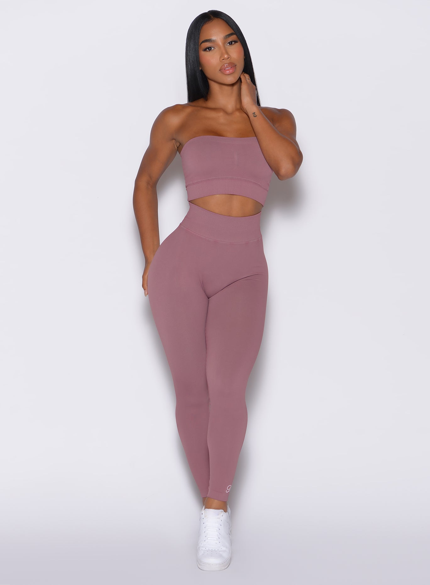 front profile view of a model in our cheeky seamless leggings in satin color along with the matching pullover
