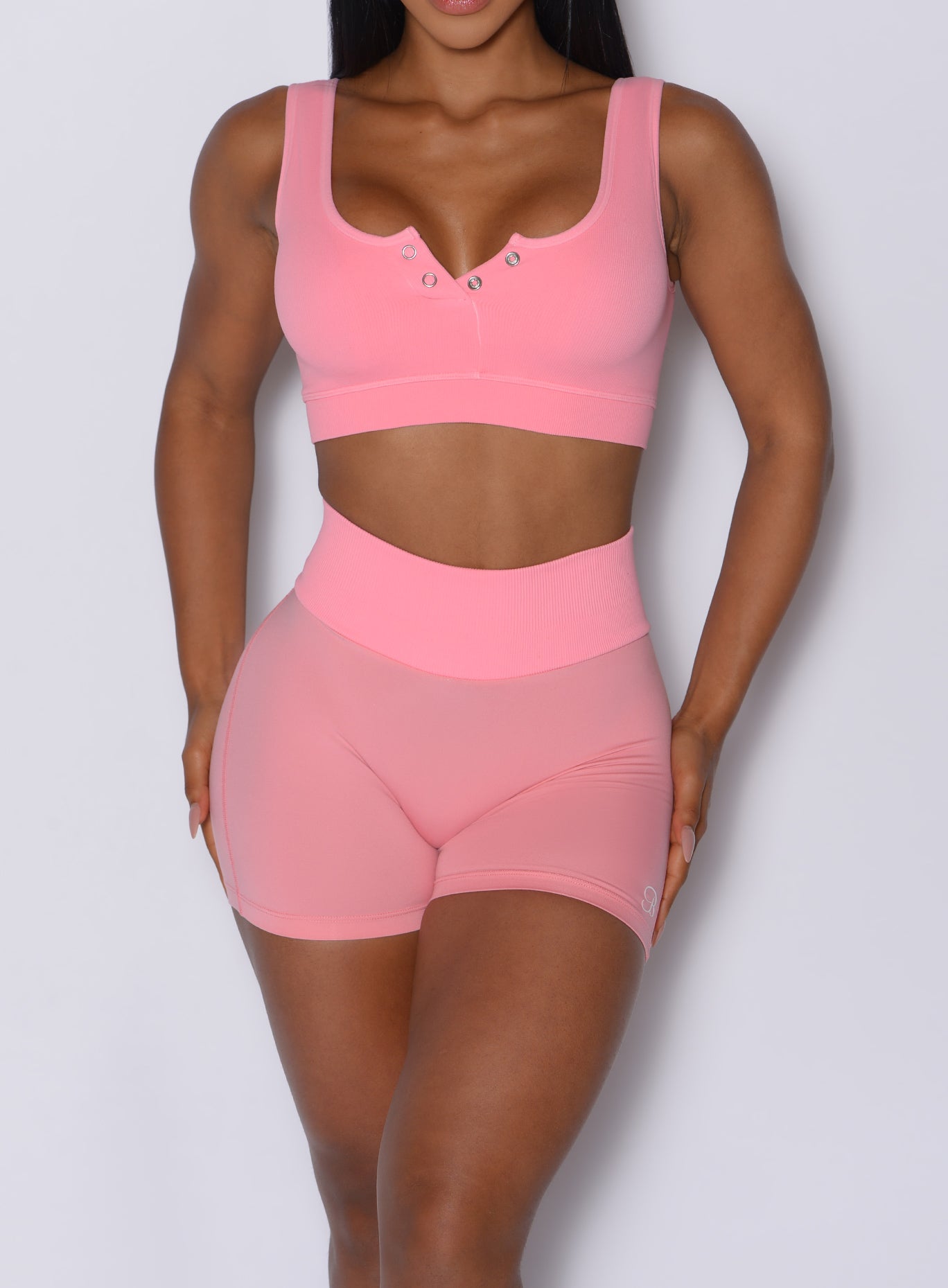 Peach Burst Figure Scrunch Shorts with a snatched ribbed waistband for a sculpted gym fit.