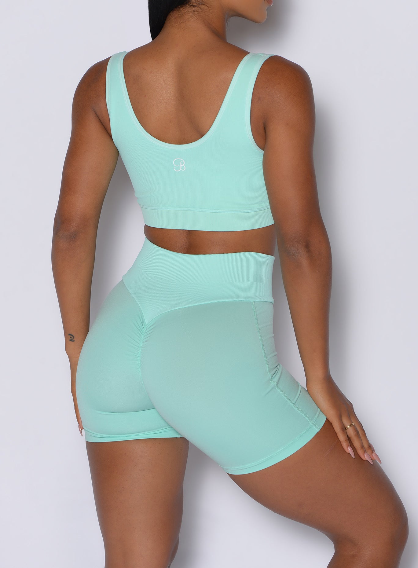 Spring Mint Figure Scrunch Shorts with booty-contouring seams for a sculpted, gym-ready look.