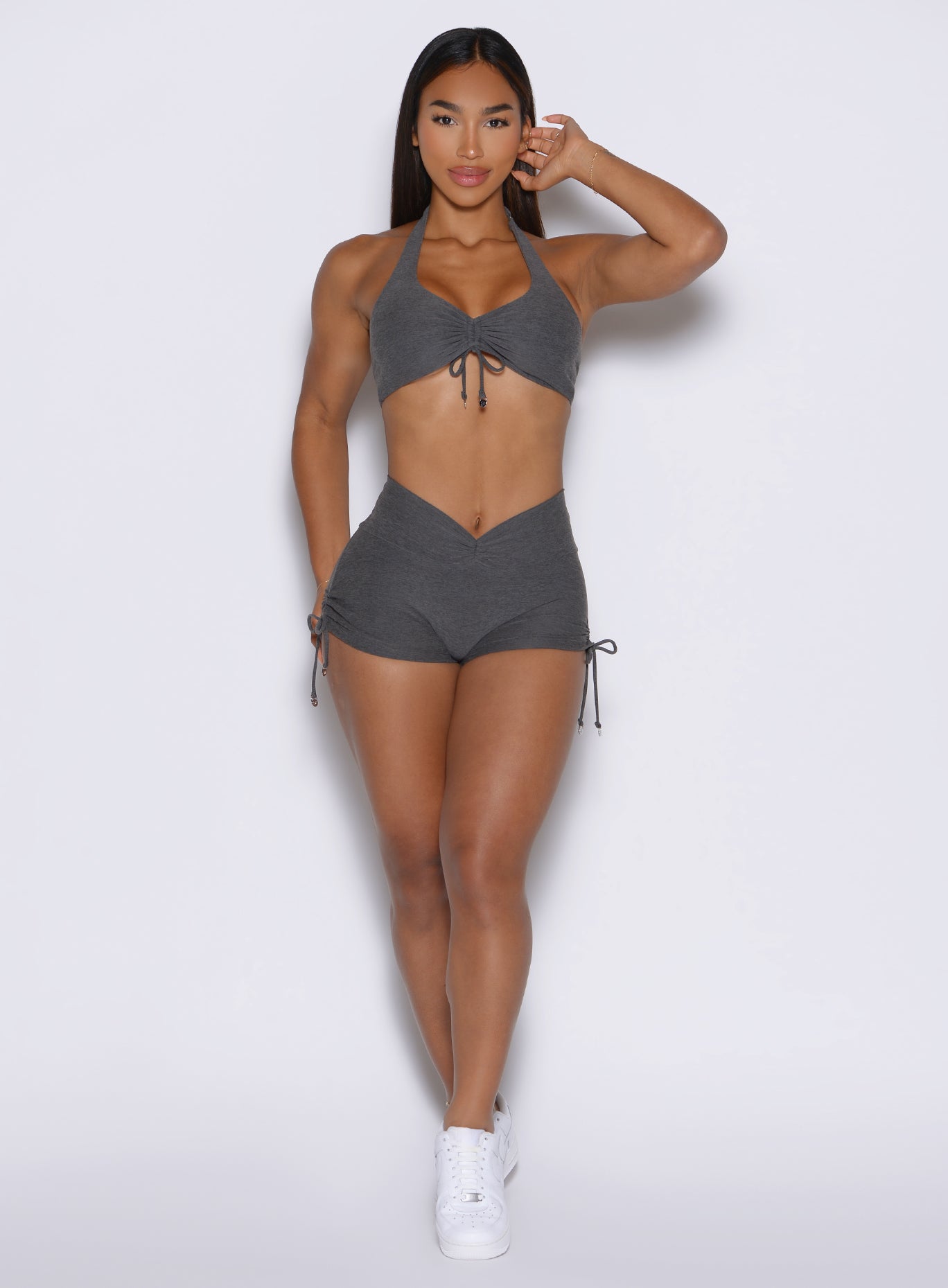 frontal view of a model wearing the Charm Fit shorts in steel shadow color