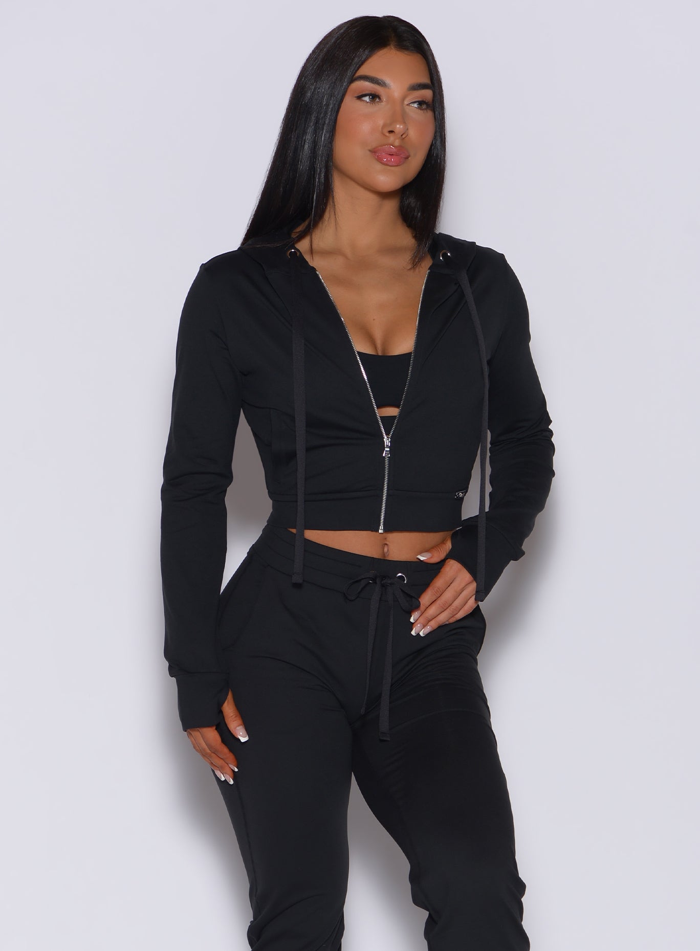 Sleek black Signature Jacket and joggers in breathable, technical fabric for a sculpted fit.