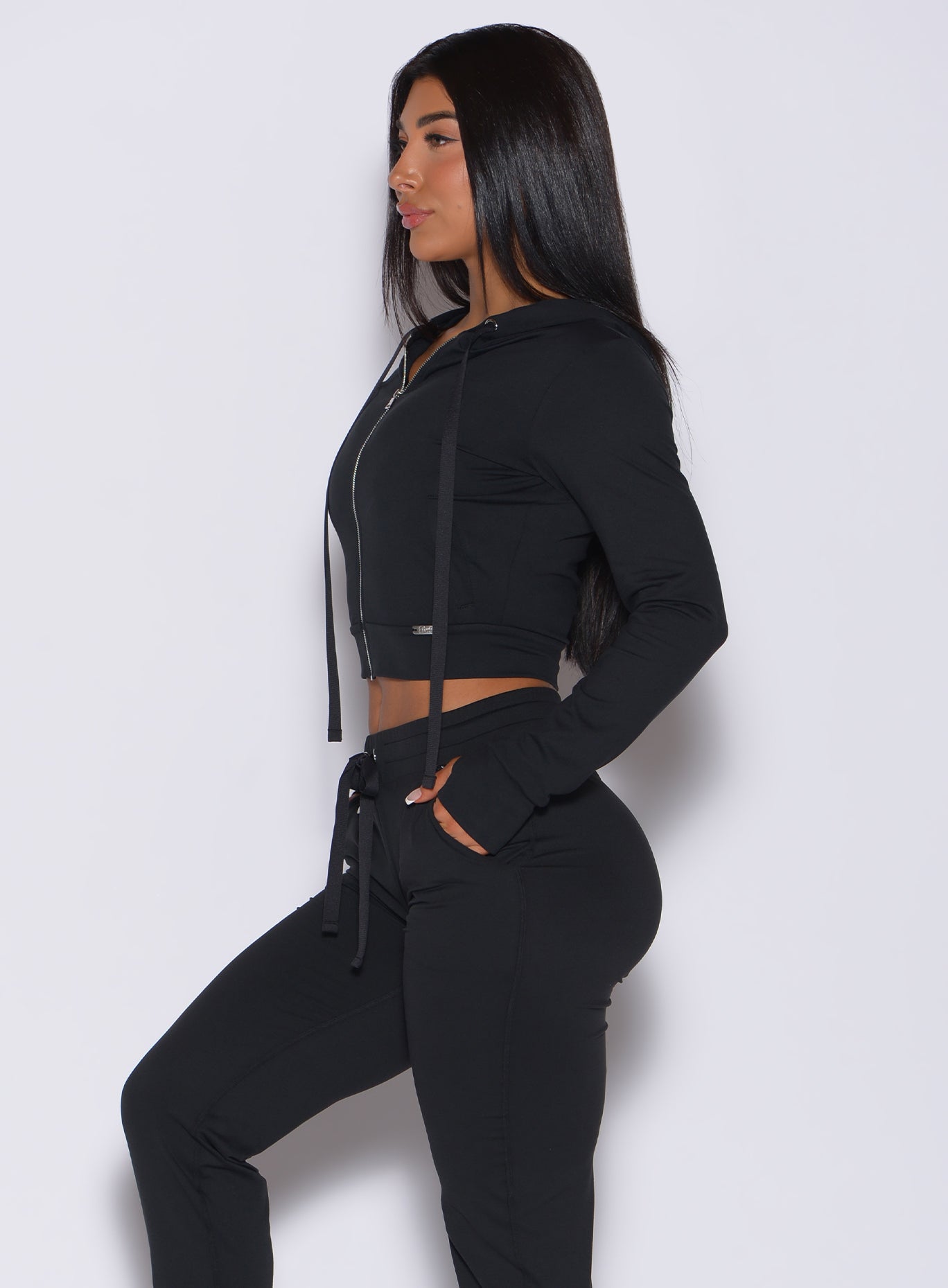 Sculpting black Signature Jacket paired with matching joggers for a sleek, cozy lounge set.