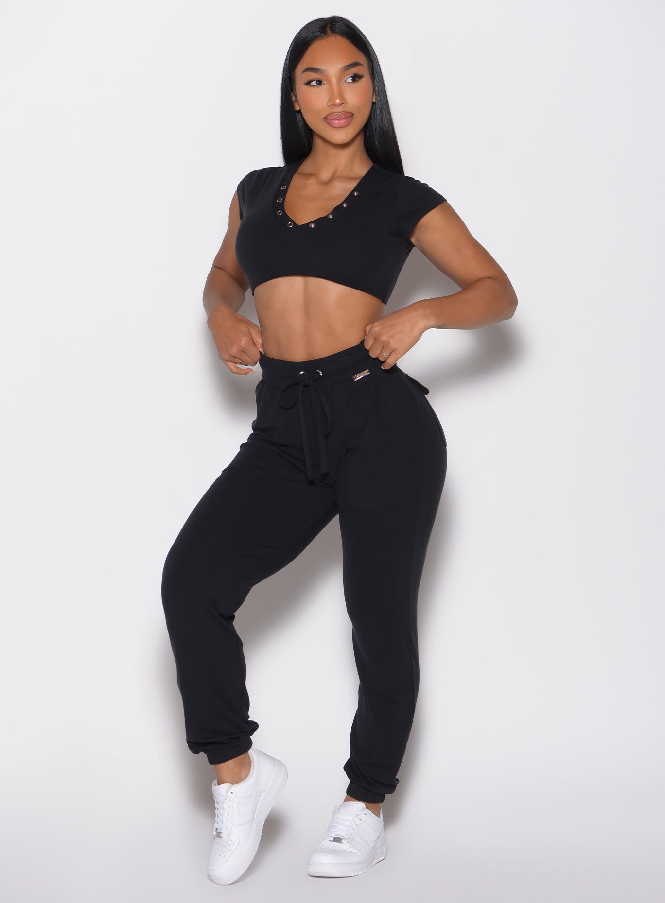 front profile view of a model looking to the left side wearing the Snap Rib Joggers in black color