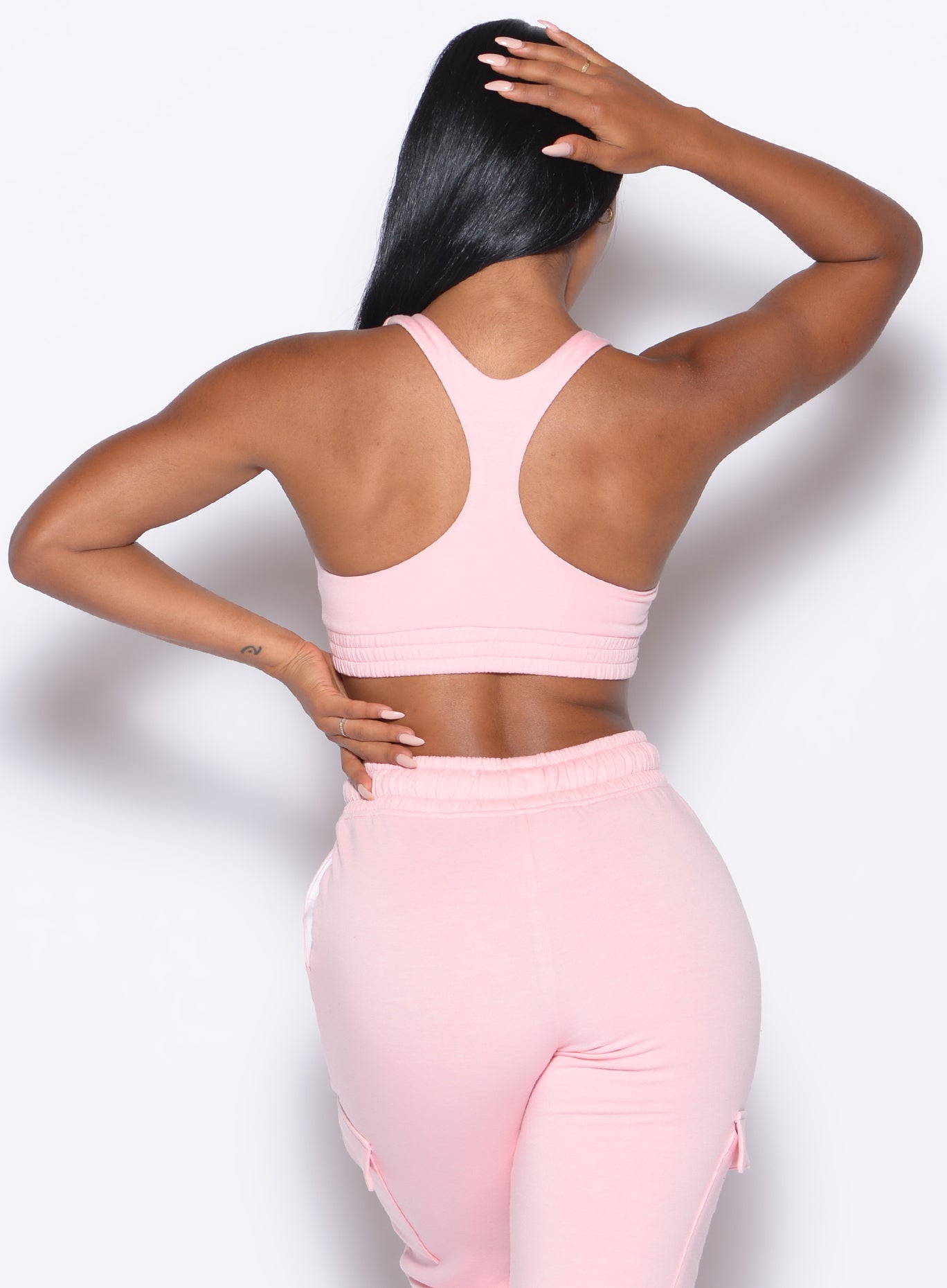 Tickled Pink Sweat Lounge Bra featuring a racerback design for stylish, low-impact gym recovery.