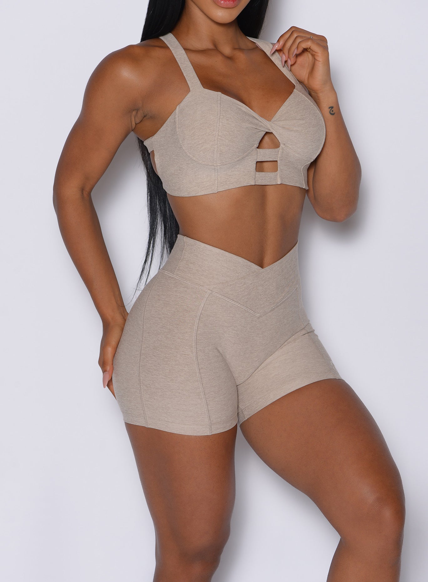 Taupe Tiny Waist Shorts with V-cut waistband and scrunch butt for a sculpted gym look.