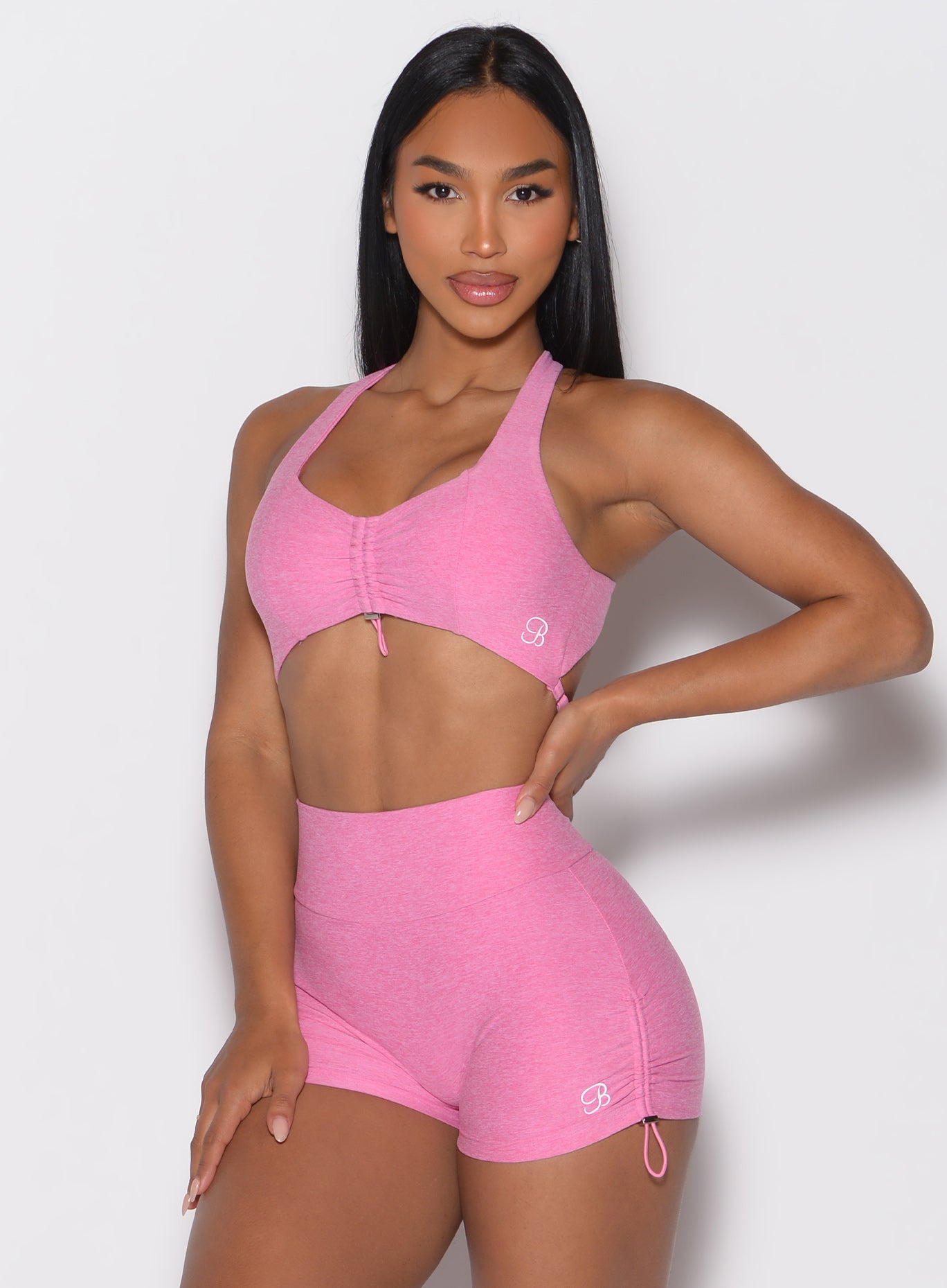 Heathered Bubblegum Toggluxe Bra with custom front toggle and open back for peak gym performance.