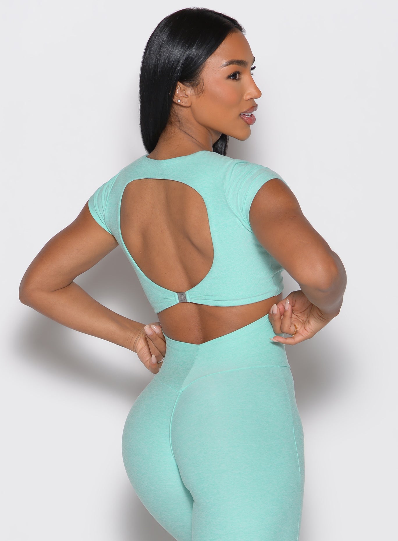 Open-back Oasis Toggluxe Tee featuring an adjustable toggle for a customized, sculpting gym fit.