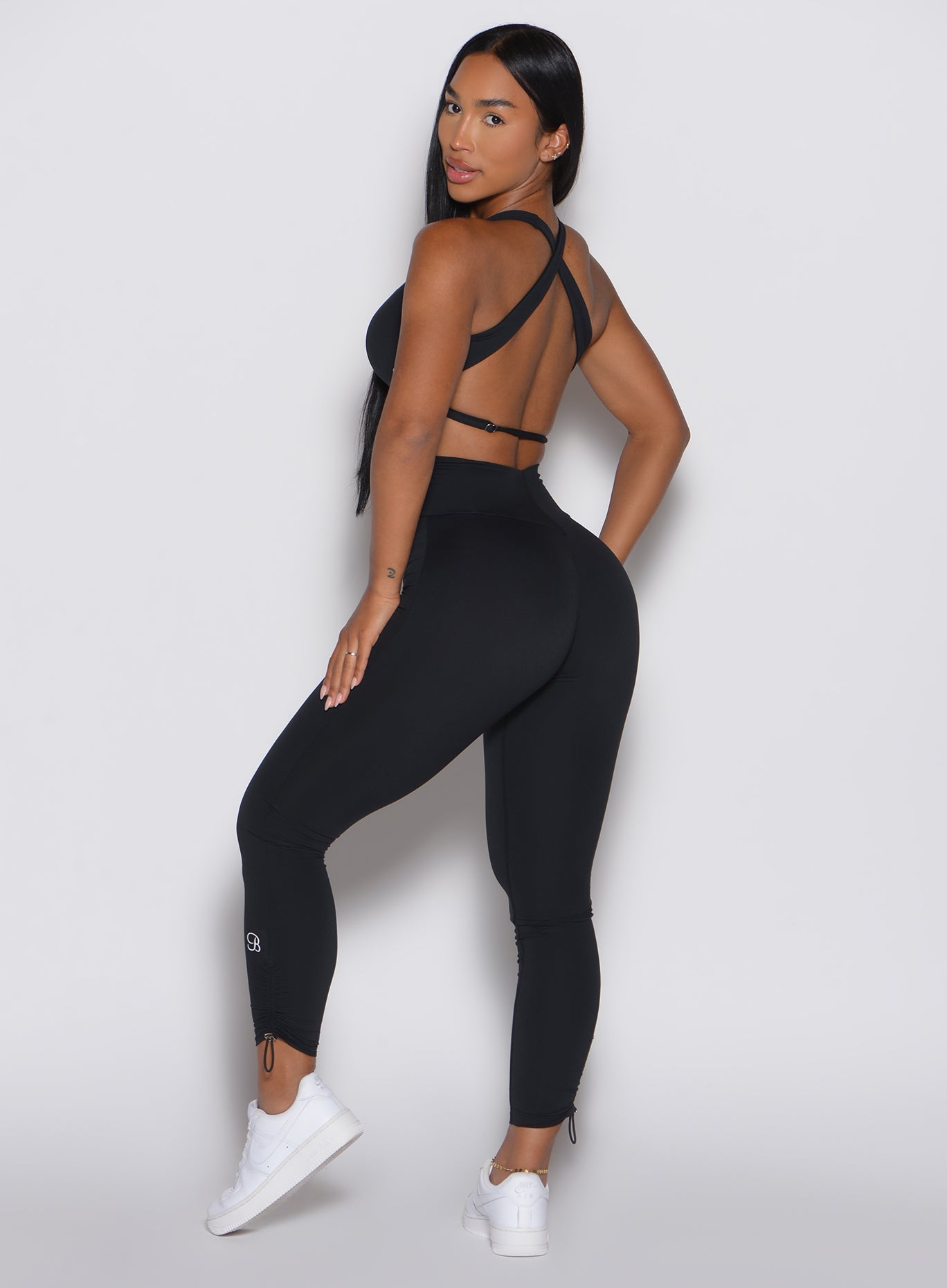 High-waisted black Toggle Pull Leggings with adjustable side cords for a custom squat-proof fit.