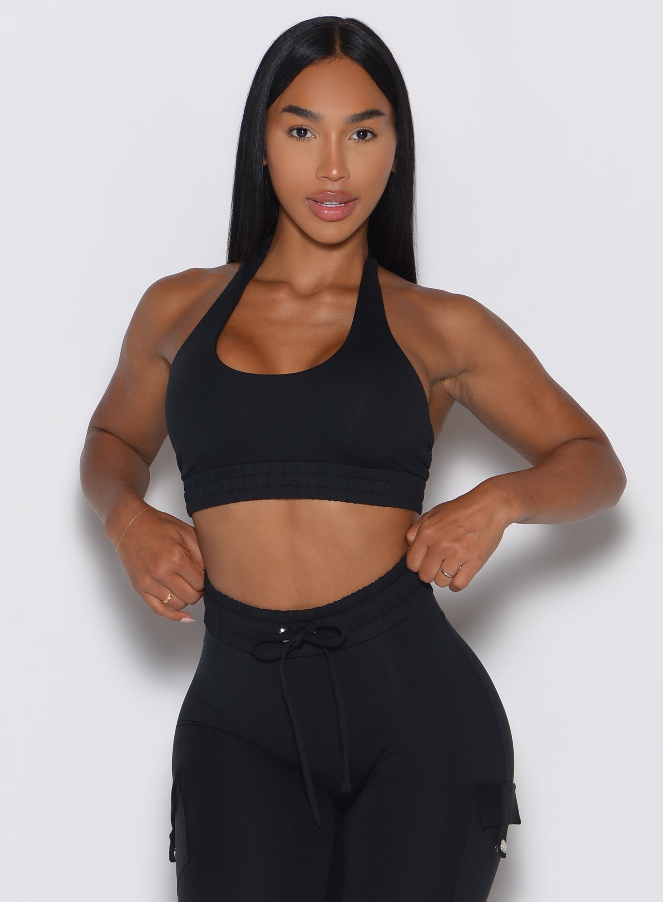 Black Trailblaze Sports Bra featuring a scooped neckline and cinched underbust band for a sculpted fit.