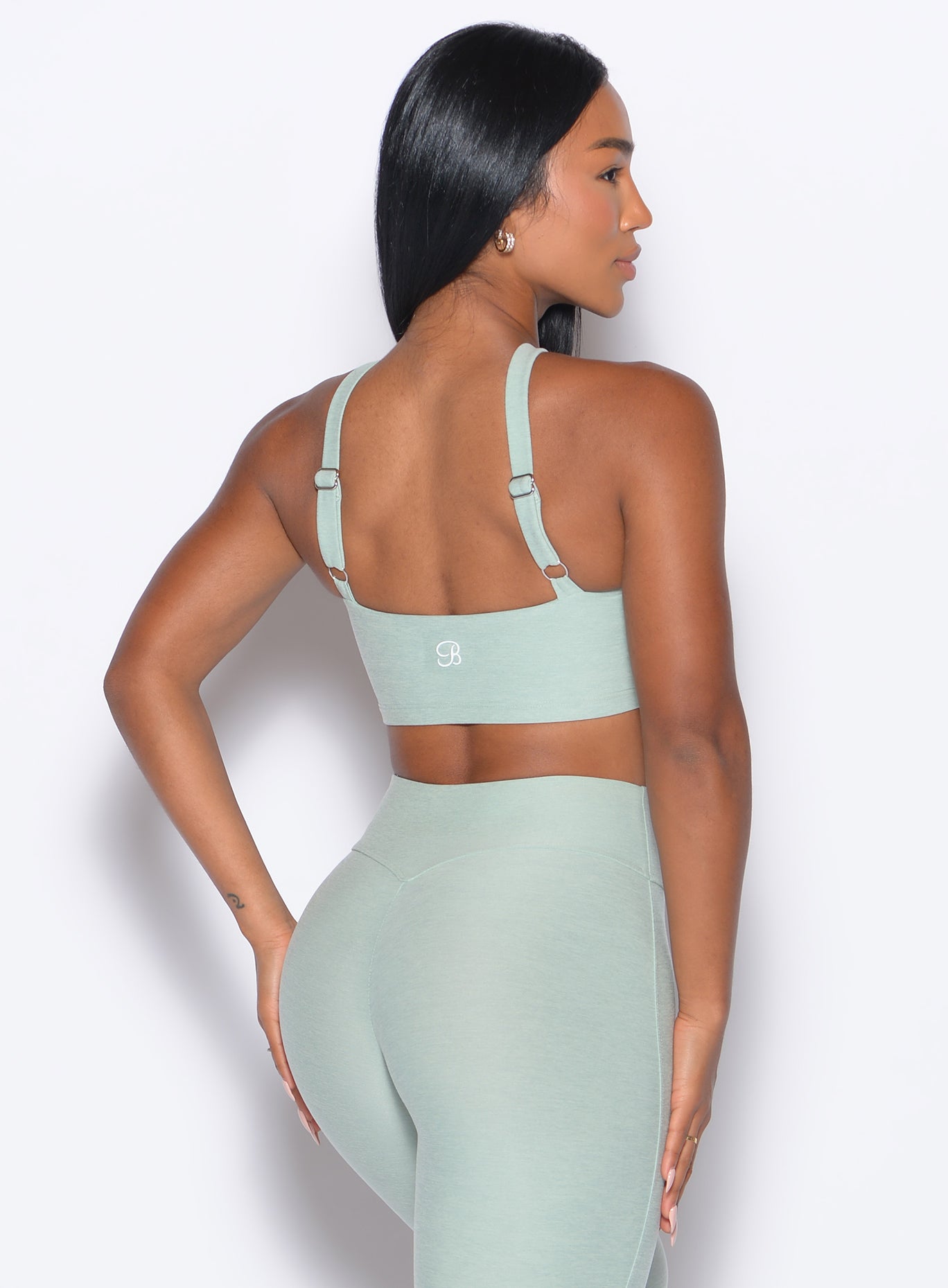 back right side profile view of our model wearing the Twist Up Bra in soft aloe color