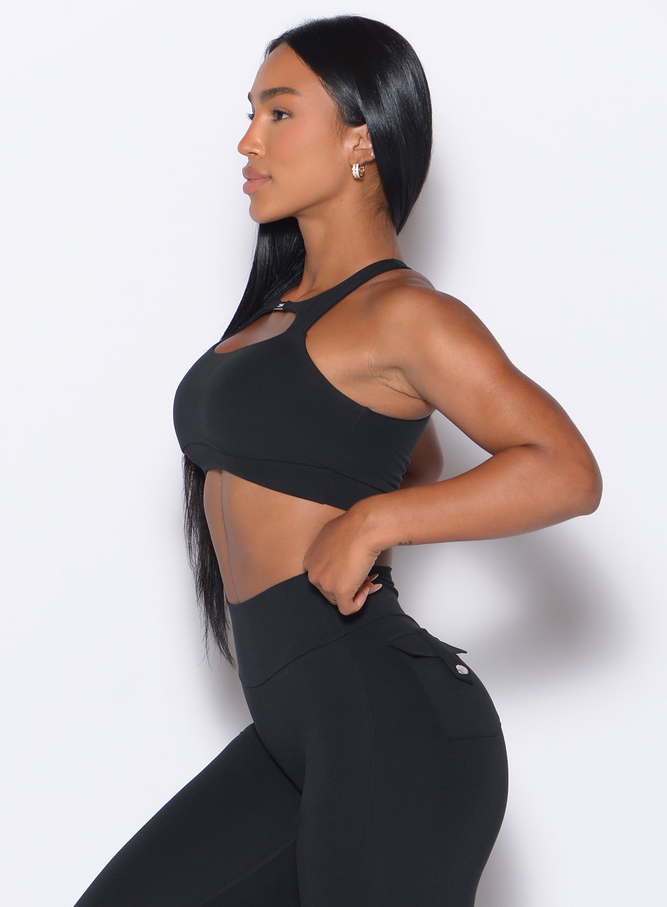 Versatile black Two Way Bra paired with high-waisted leggings for a sculpted gym look.