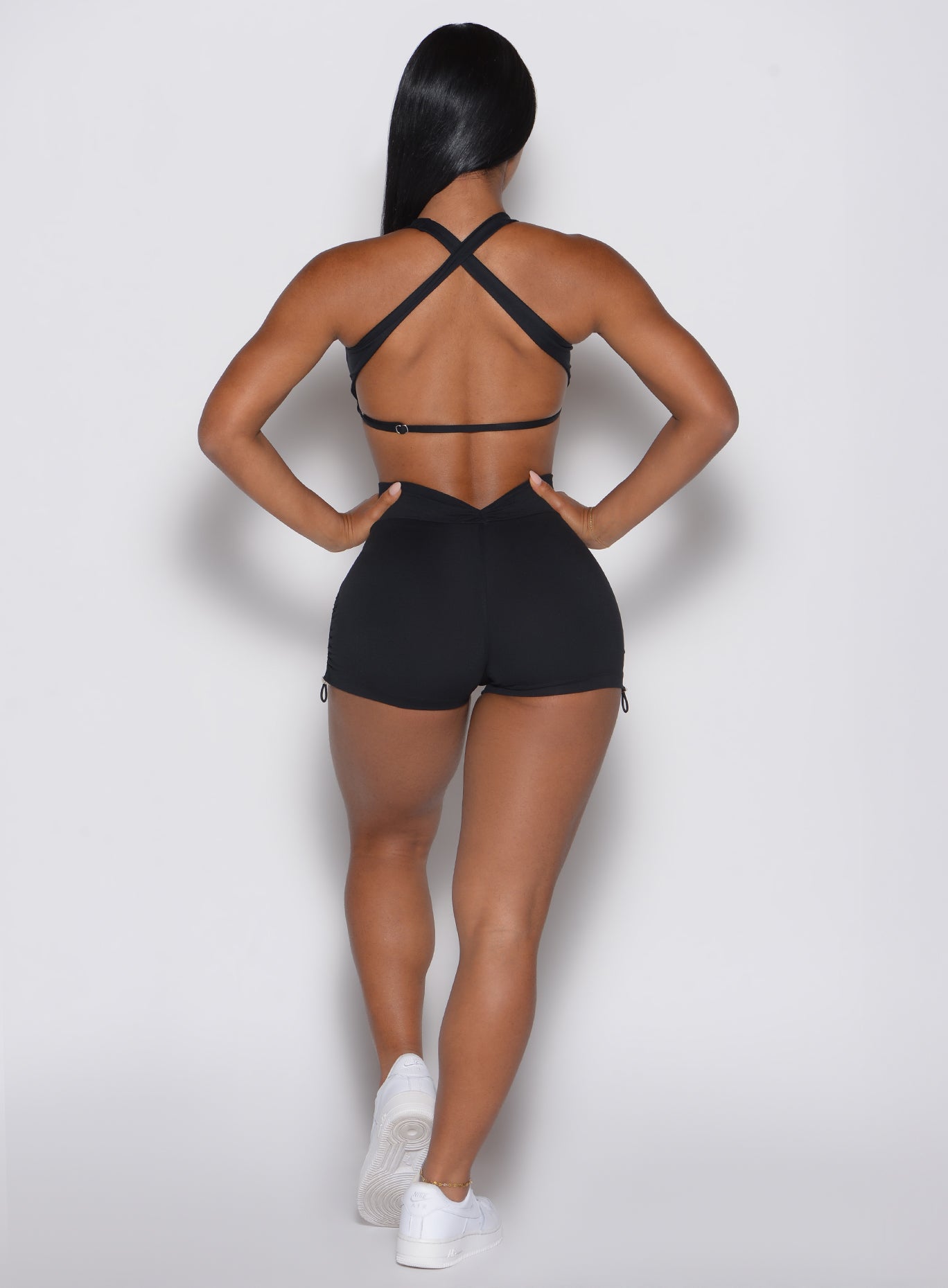 Black V Back Toggle Shorts featuring a sculpting V-waistband and adjustable toggle detail.