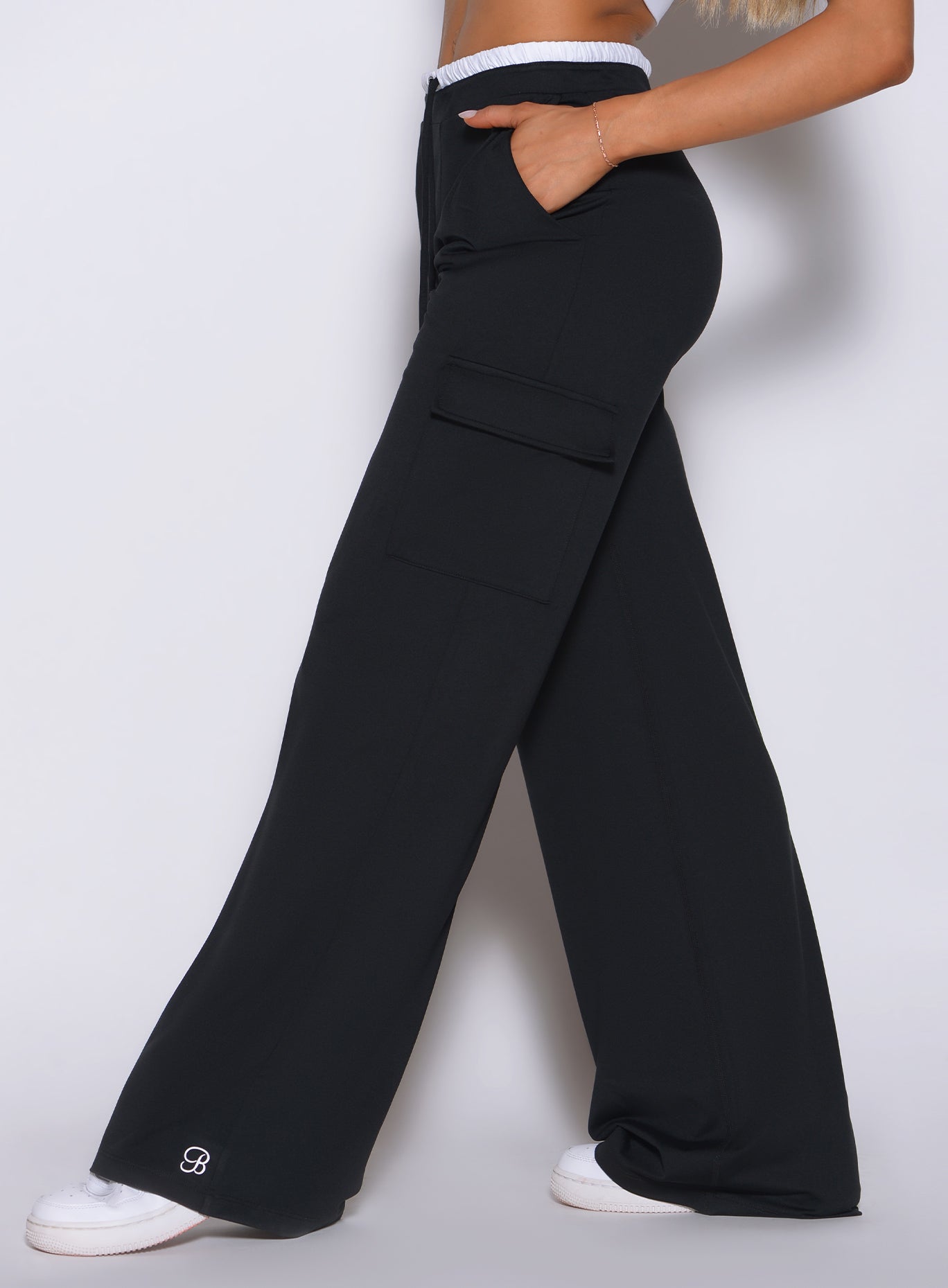 Bombshell Sportswear black wide-leg cargo lounge pants side detail featuring high-waist fit, soft drape fabric, side cargo pockets, relaxed silhouette, and elevated women’s athleisure styling