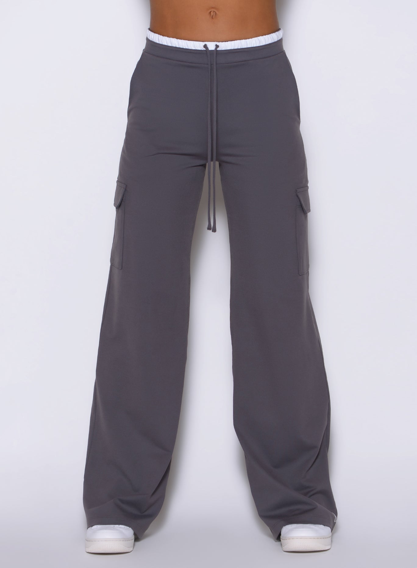close up front view of the Bombshell Sportswear wide-leg cargo lounge pants in champion gray color, with side pockets and adjustable drawcord, designed for everyday wear