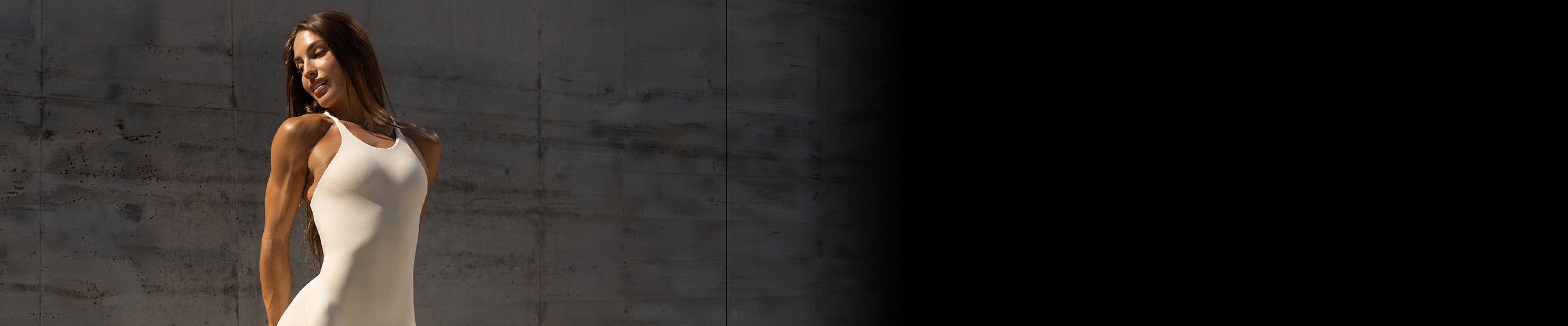 Athletic cream jumpsuit showcasing breathable, second-skin fabric designed for gym workouts.
