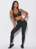 Front view of the model wearing the camo leggings in charcoal
