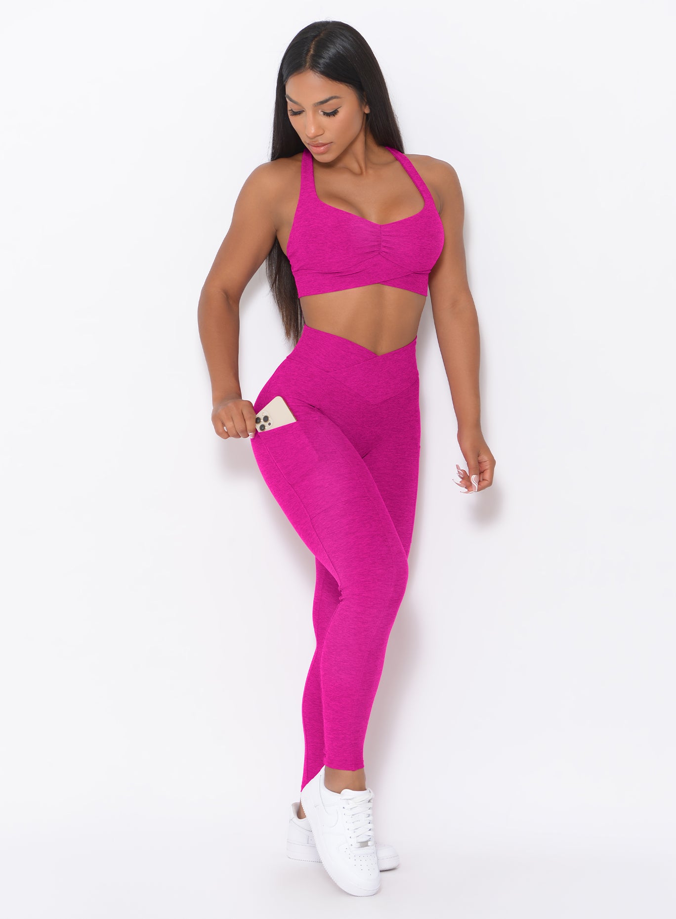 Ultra Pink Contour Leggings featuring deep side phone pockets and a high-waisted gym fit.