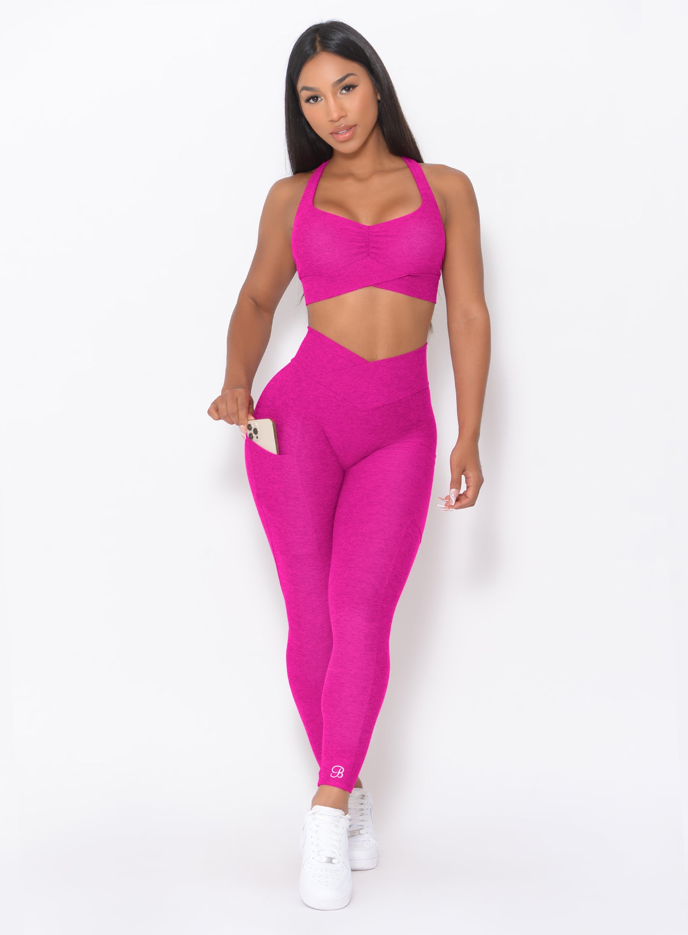 Ultra Pink Contour Leggings with V-cut waistband and side phone pocket for an elite gym fit.