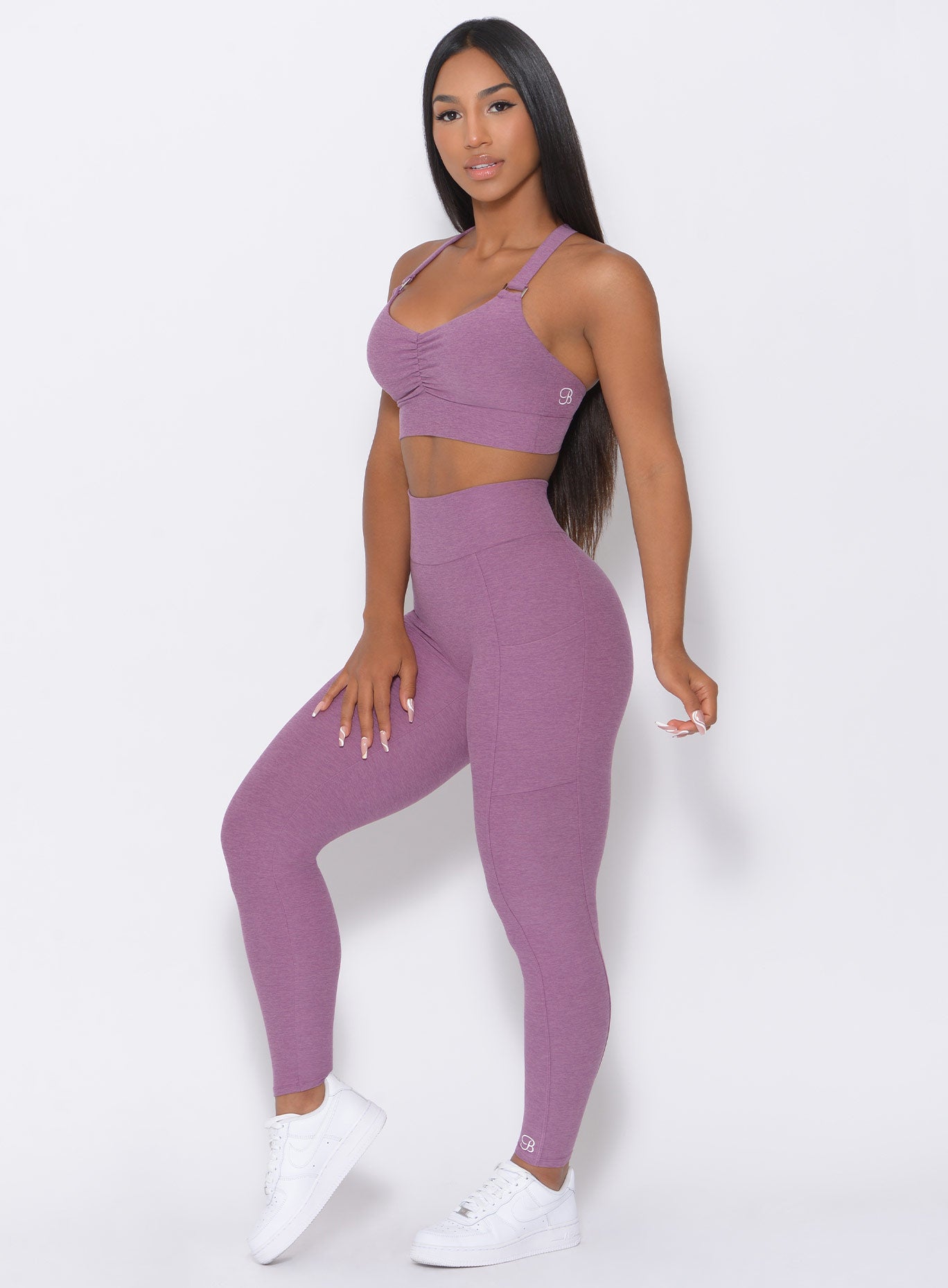 Left side view of the model in our lavender curves high waist leggings