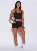 Model facing forward in our black joggers shorts and a matching bra