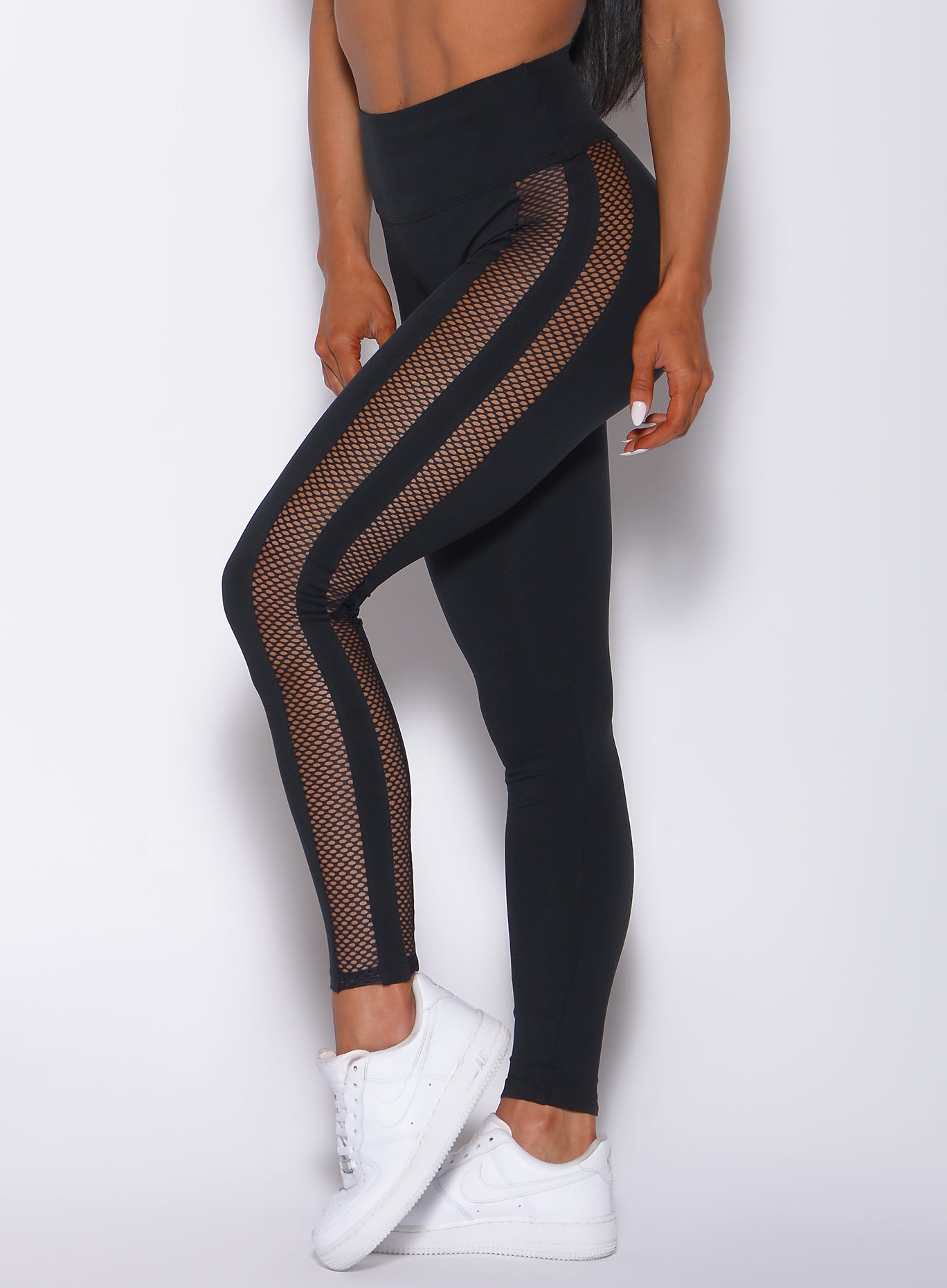 Sculpting black Mohawk Leggings with mesh panels and squat-proof fit for gym performance.