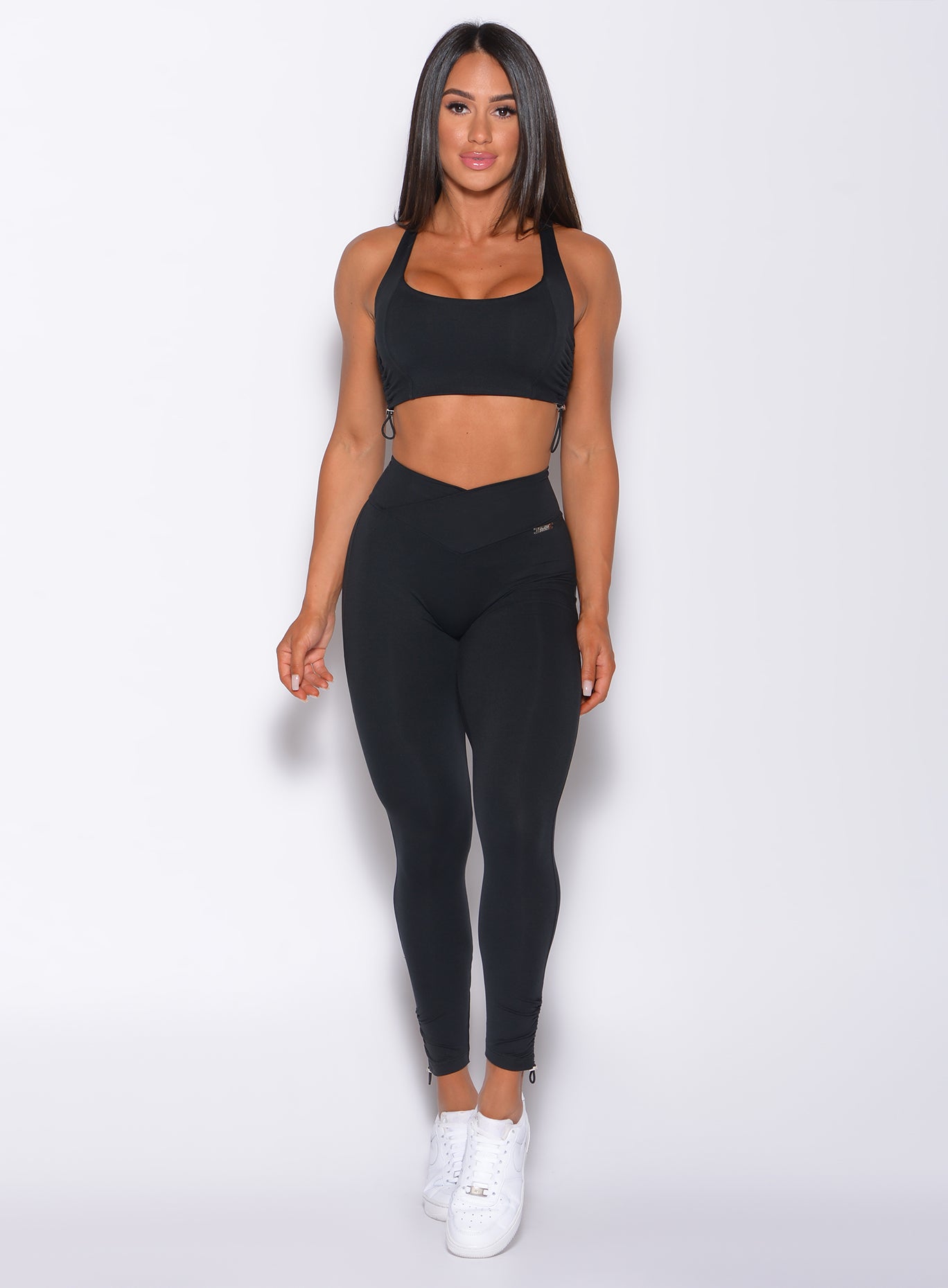 Black Contour Toggle Leggings with adjustable ties and a V-cut waist for a sculpting gym fit.