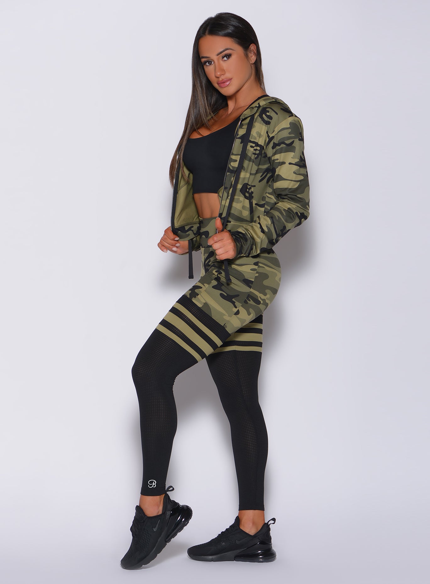 Sculpting green camo Scrunch Thigh-Highs with breathable mesh and a high-waisted gym fit.