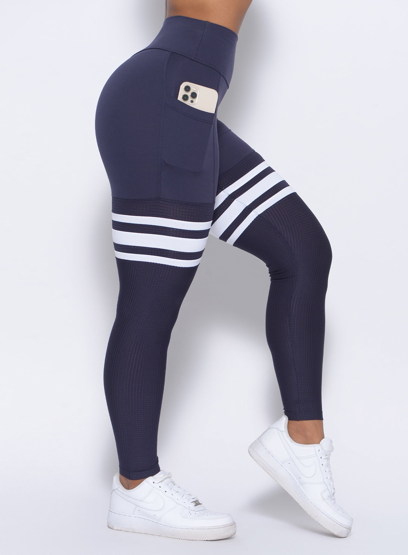 Twilight Blue Perform Thigh Highs with white stripes, side pockets, and a sculpting gym fit.