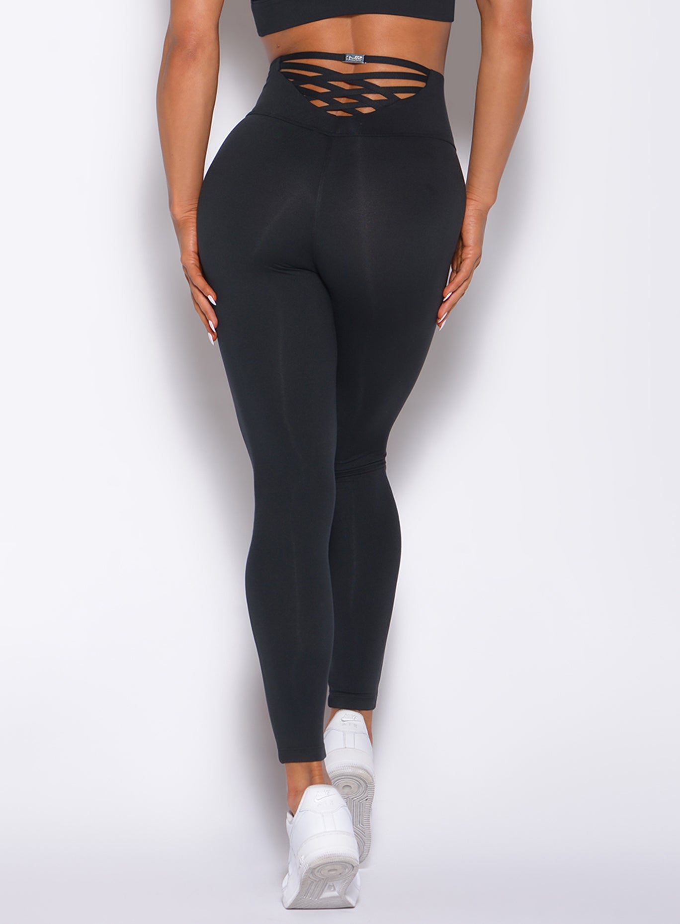 High-waisted Sexy Back Leggings in Tiger Black with sculpting fabric and squat-proof support.